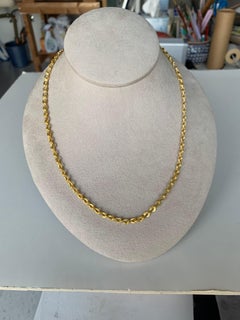 Catena in oro 22 carati con chiusura in rubino