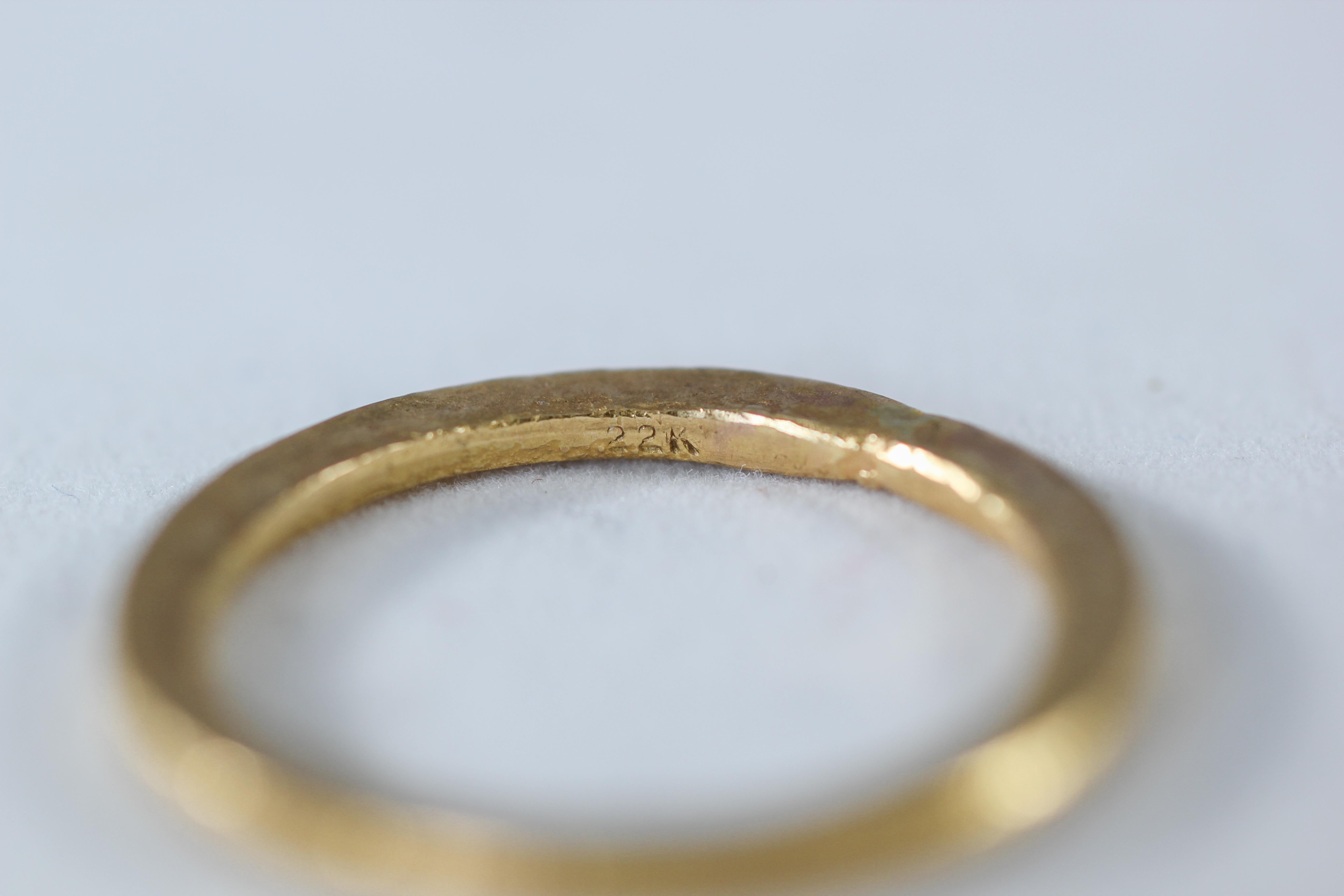 A bridal or wedding band ring in recycled 22k gold. Simplicity Medium Disk contemporary unisex wedding band ring is designed and handcrafted by AB Jewelry NYC. Unisex, Ideal for a man or a woman. Wear it alone or as a fashionable stacking ring
