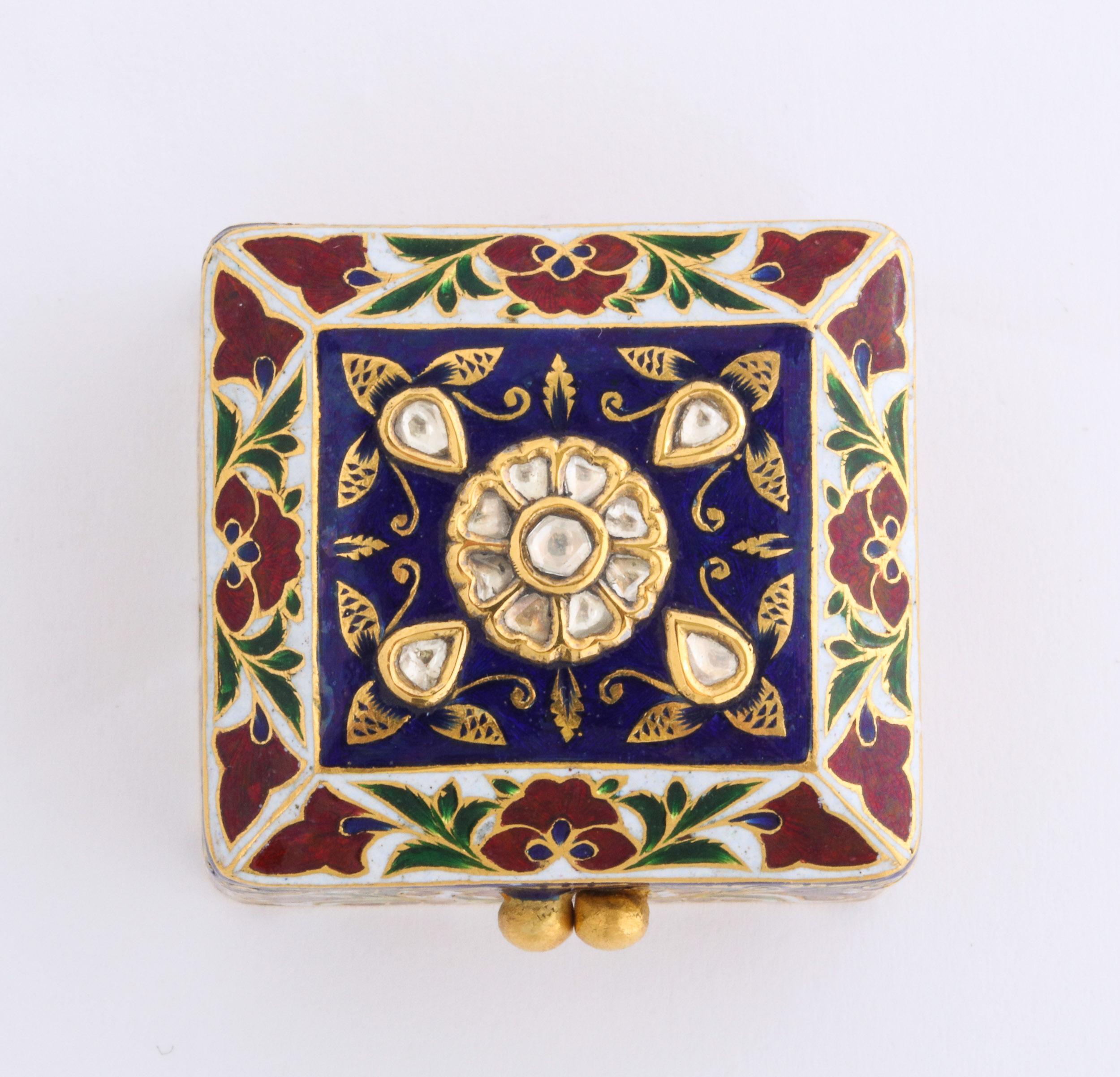 22-karat Indian gold enamel and diamonds pill snuff box, Mughal style, Jaipur.

Finely painted with flowers, set with rose-cut diamonds, the lid opens to hand painted enameled peacock.

Very high quality object. 

Weighs 42