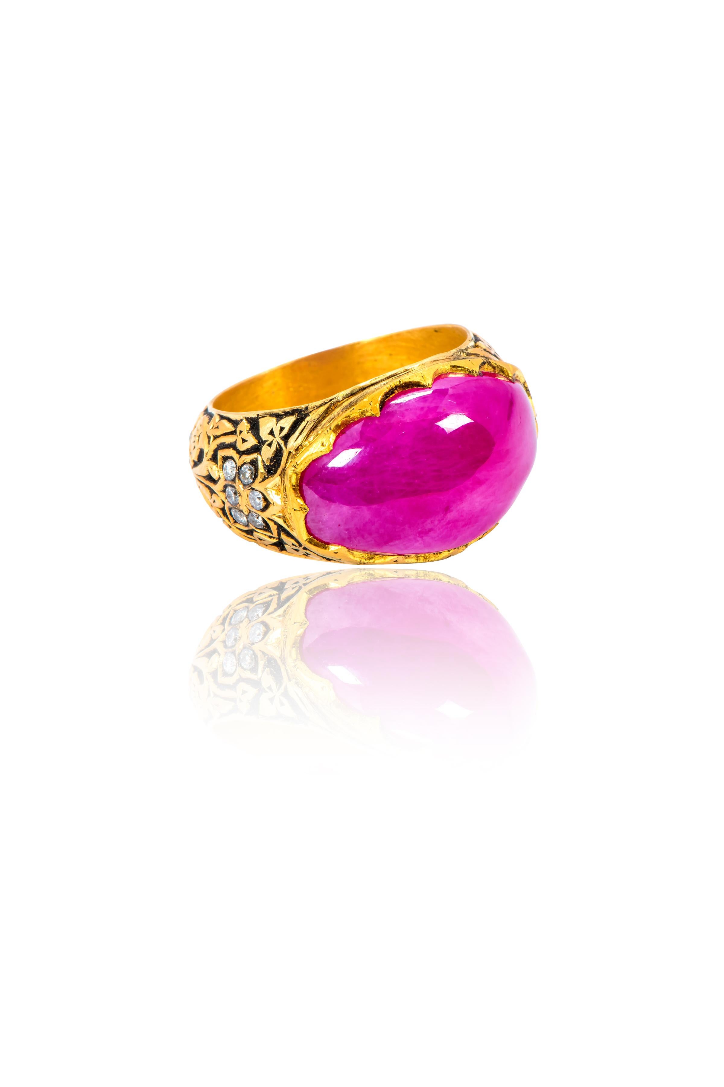  22 Karat Yellow Gold 17.08 Carat Cabochon Ruby Diamond Ring

The stately solitaire ruby oval domed cabochon is brilliantly juxtaposed by the vivid definements in the 22k goldwork. The handcrafted minute detailing on the band with Polki diamonds