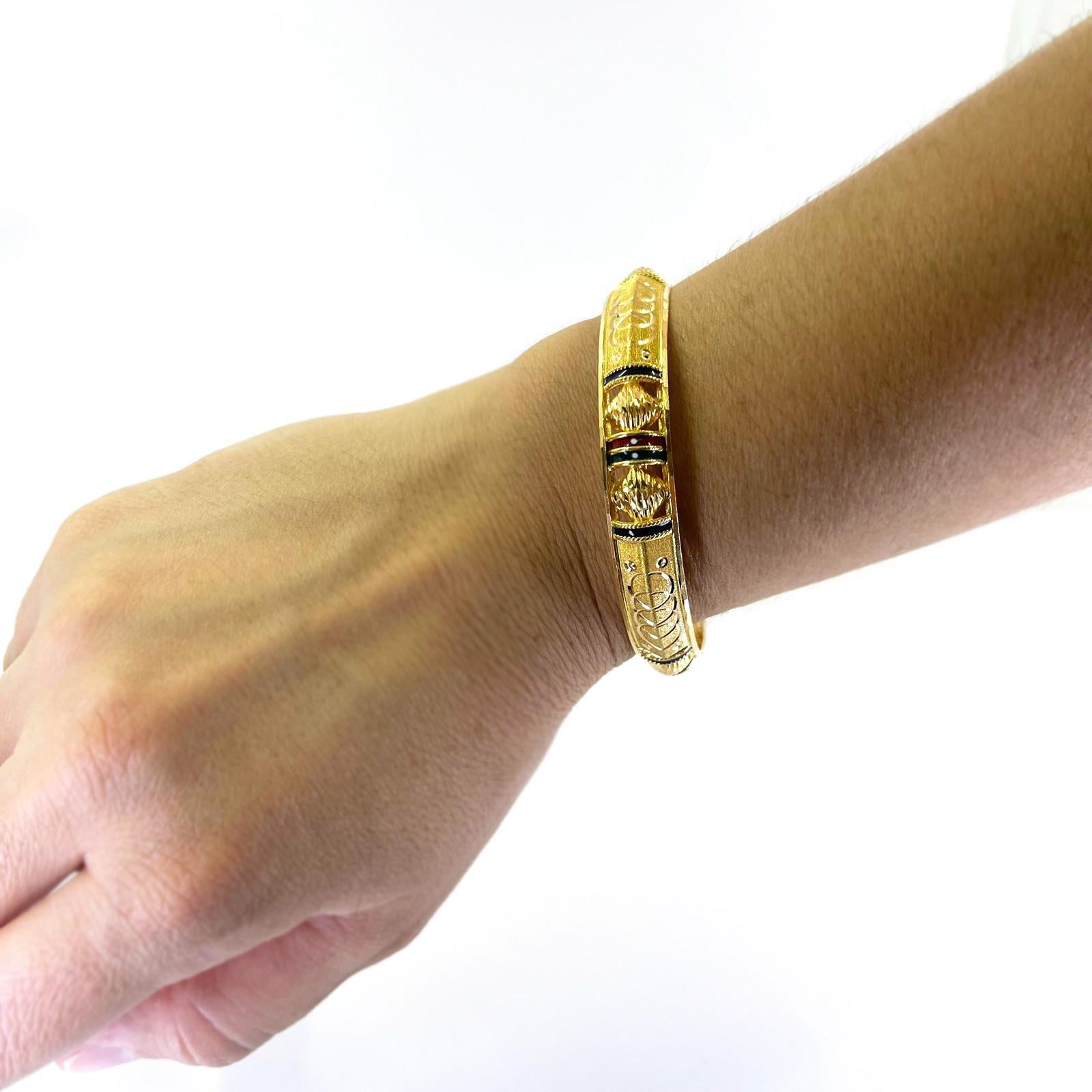 22 Karat Yellow Gold Bangle with Enamel and Engraved Accents. Engraved with Serial Number. Finished Weight is 18.0 Grams. 2.4 Inch Interior Diameter to fit up to a 7 inch hand or wrist.