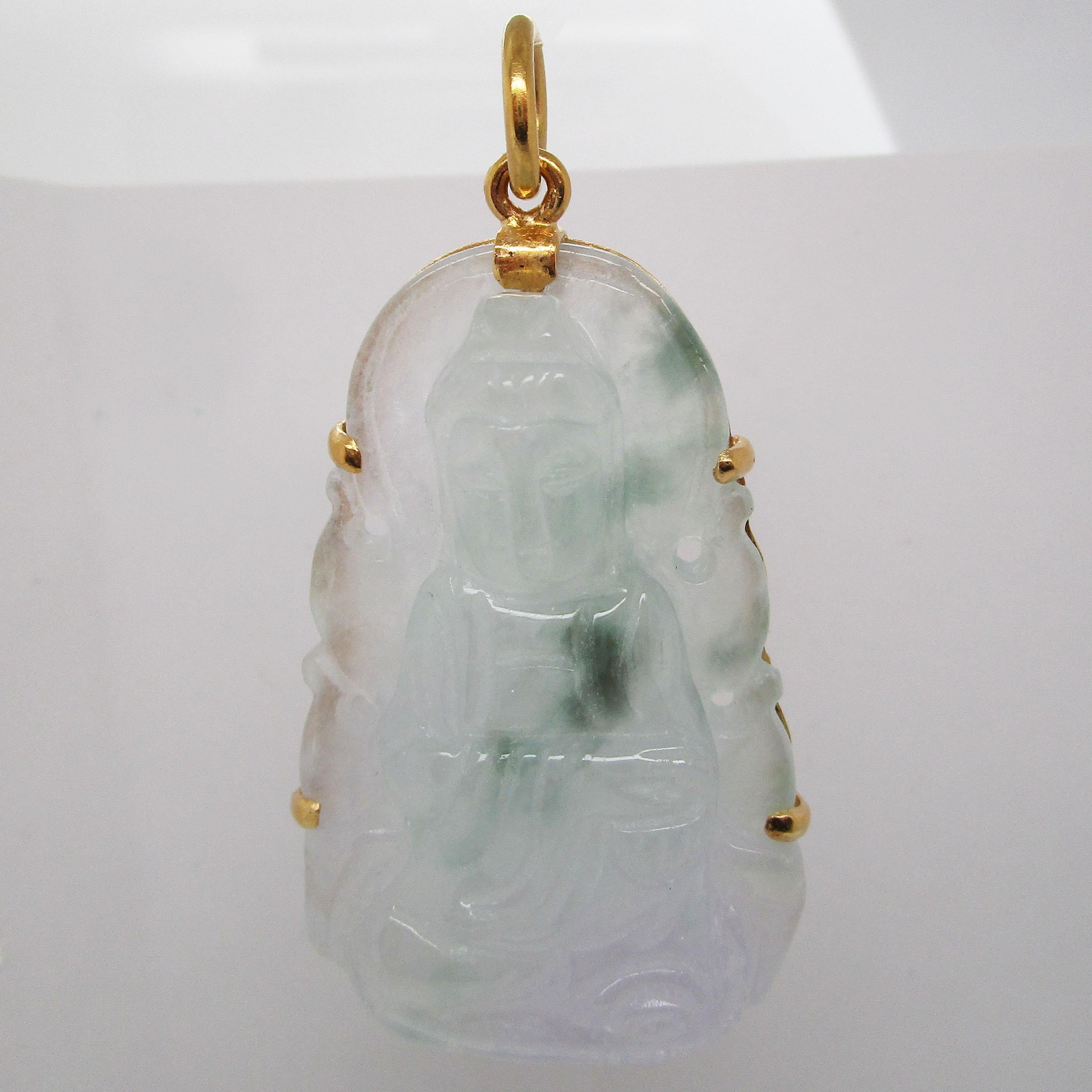 This is an absolutely gorgeous 22 karat yellow gold pendant that is an exceptional piece of carved jade. The carving depicts an elegant sitting Buddha. The carving is soft and detailed! This piece of jade is downright stunning. According to the GIA