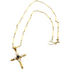 22 Karat Yellow Gold Cross Necklace with Sapphire Cabochon