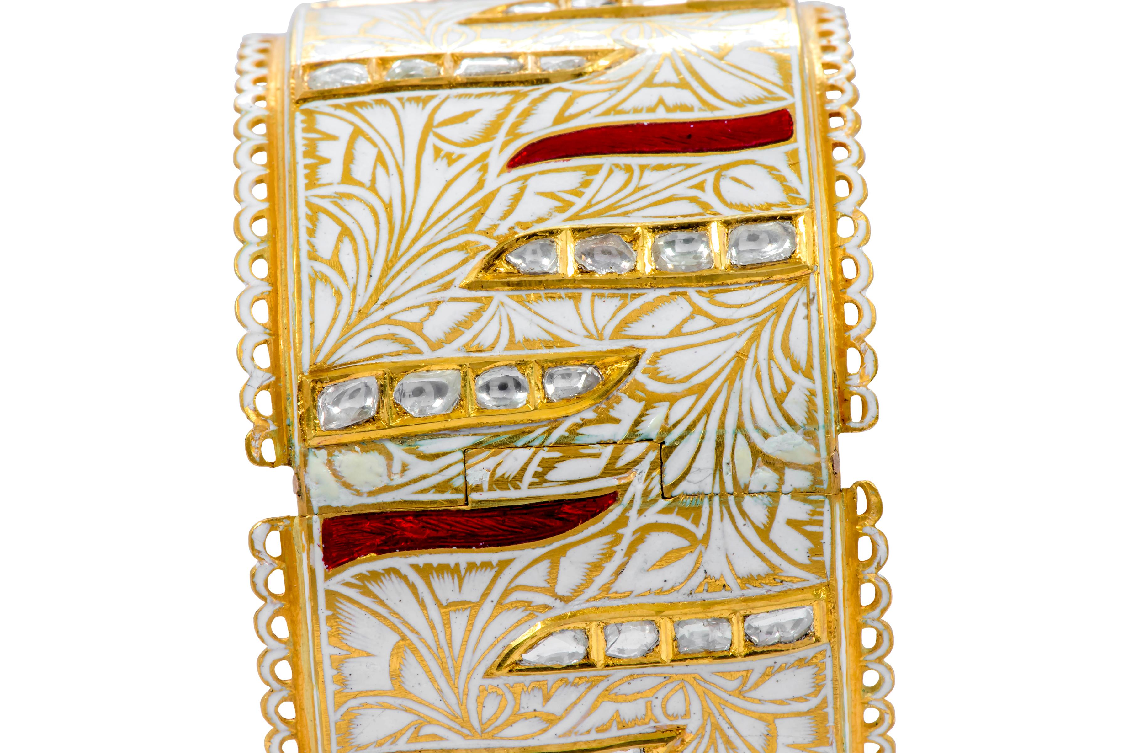 22 Karat Yellow Gold Diamond, Red, and White Enamel Handcrafted Bangle 

This exuberant antiquated Mughal period hand-crafted white and gold enamel Polki diamond bangle is heavenly. The picturesque engraving of our beloved nature with leaves,