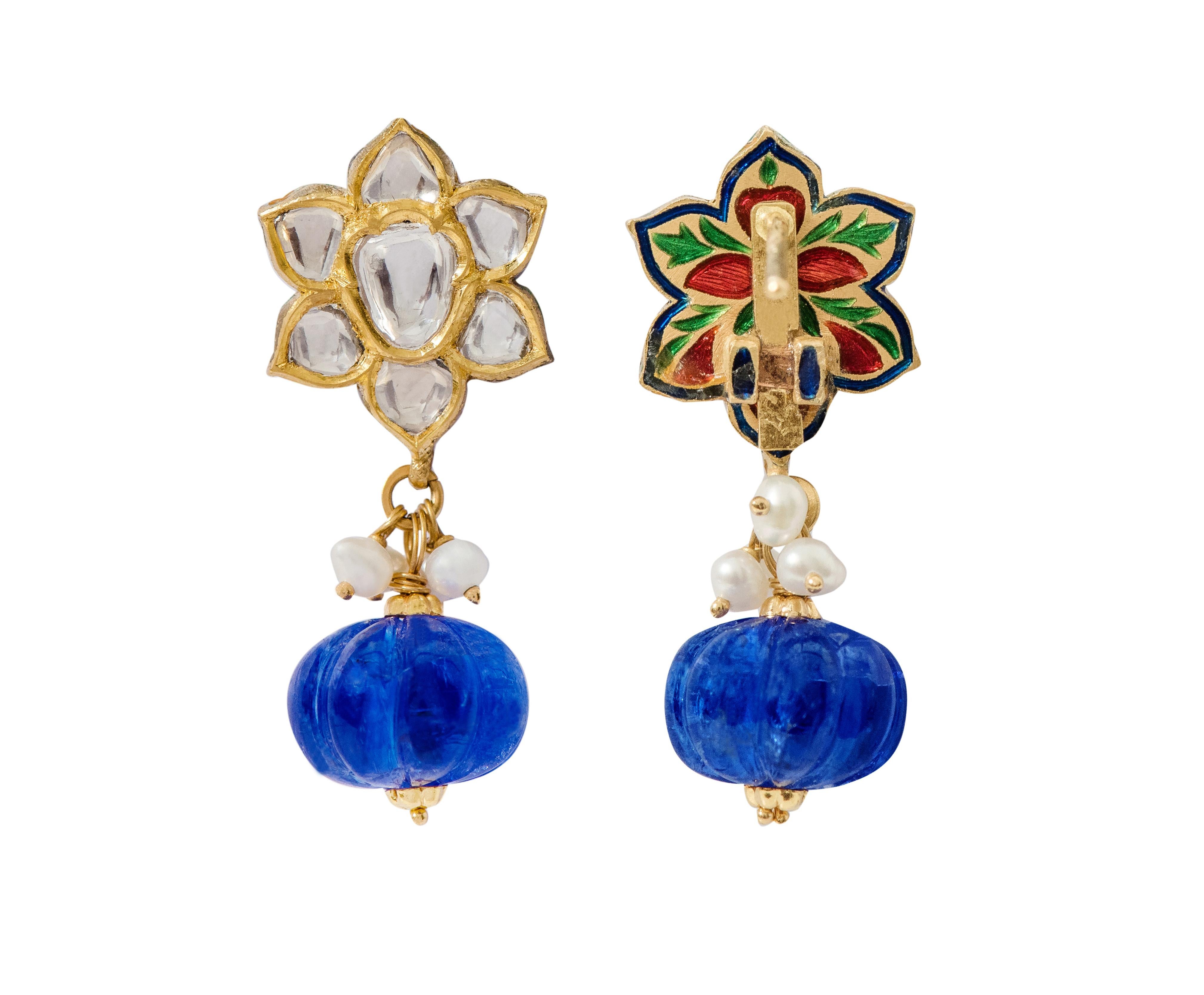 22 Karat Yellow Gold Diamond, Tanzanite, and Pearl Drop Earring with Multi-Color Enamel Work

This intricate Mughal era hand-made polki diamond and tanzanite long earring is sensational. The top part of the earring is formed of perfectly cut pear