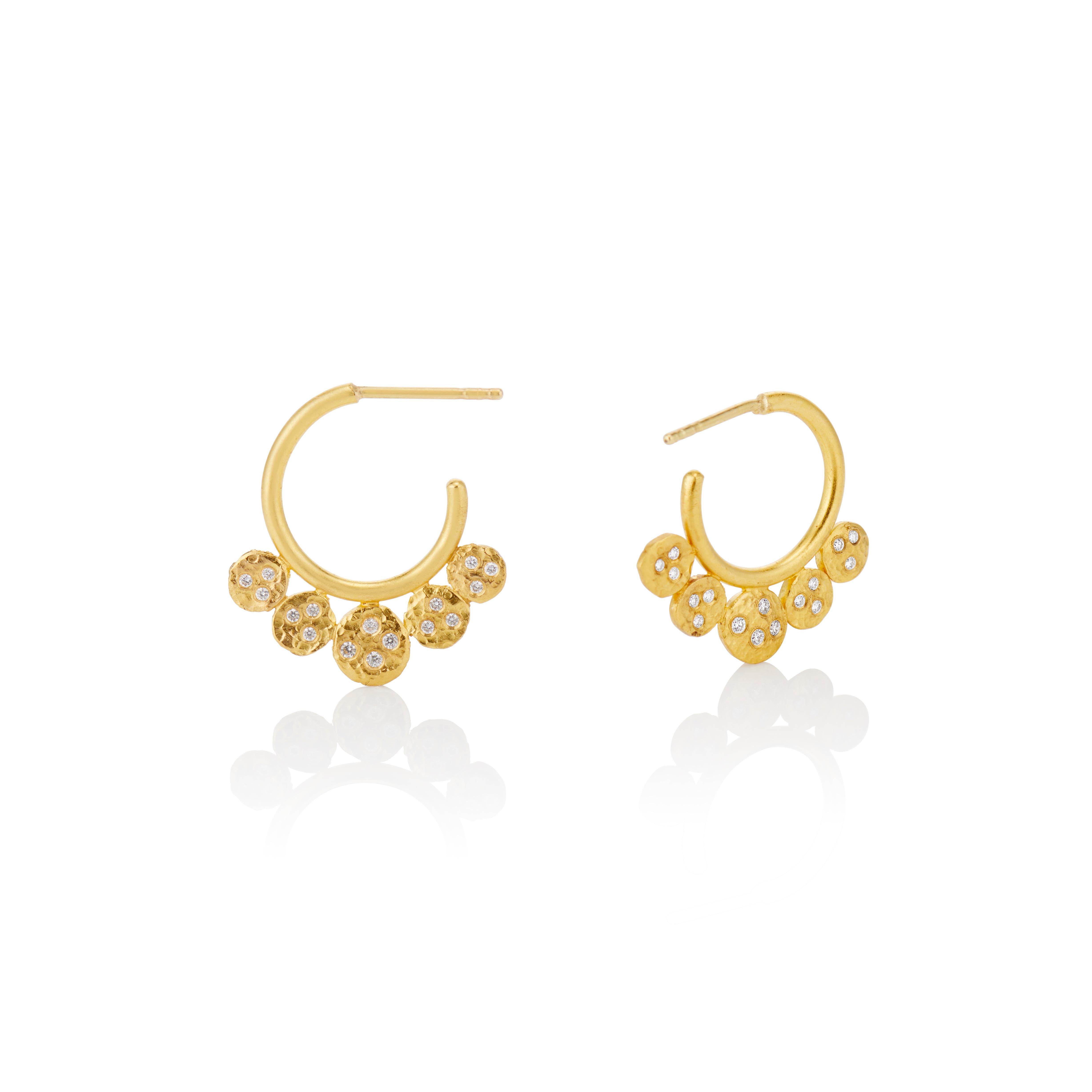 These charming and unique 22 karat yellow gold hoop earrings have five hammered gold coins sprinkled with round white diamonds .64 (total carat weight.  The hoops which measure .75 inches have 18 karat yellow posts and backs which fit securely on