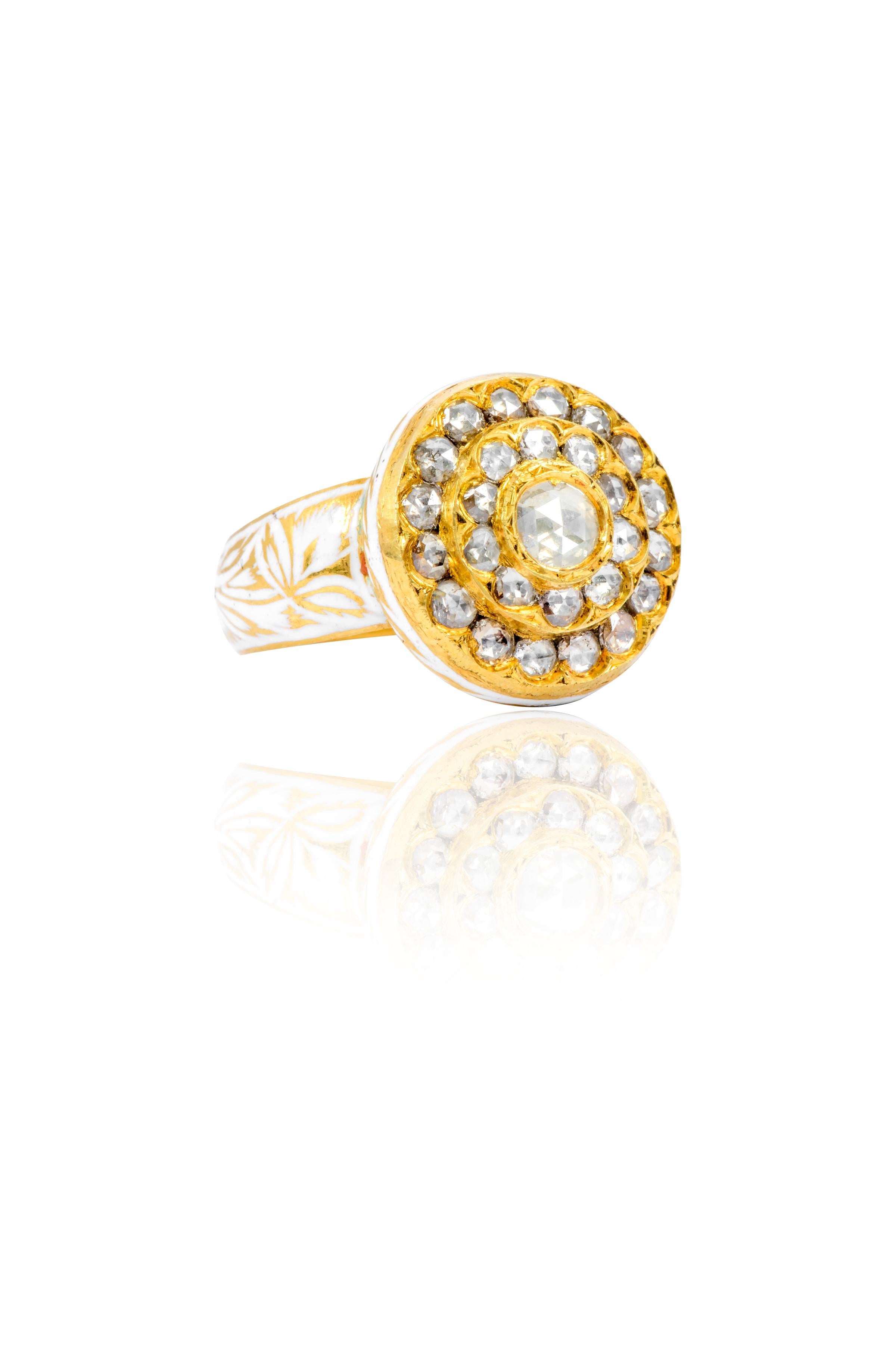 22 Karat Yellow Gold Rose-cut Diamond Ring with White Enamel Work Handcrafted

This ingenious Mughal era hand-made Polki diamond ring with white enamel is breath-taking. The solitaire round diamond Polki in the center is surrounded by two complete