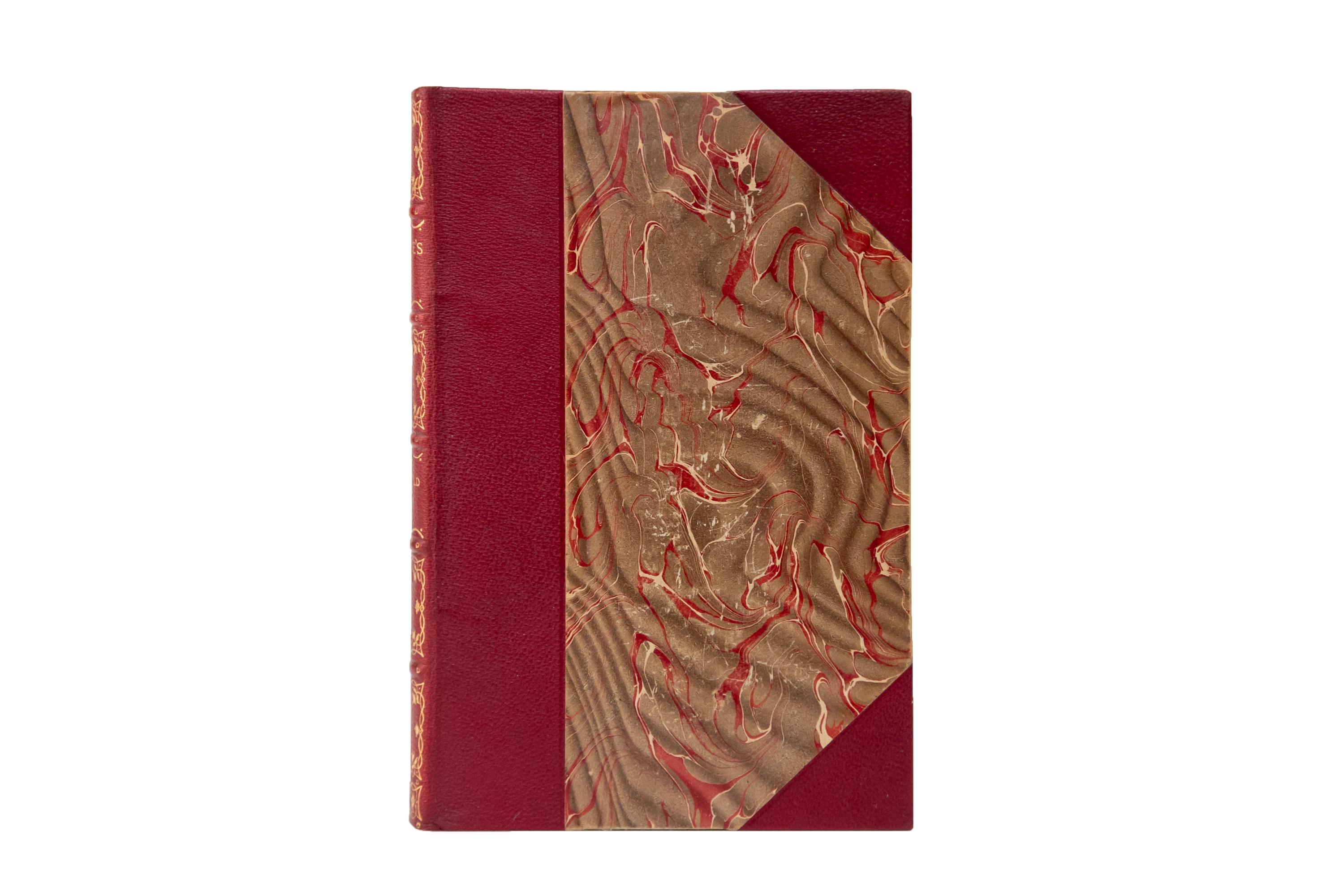 22 Volumes. Nathaniel Hawthorne, The Complete Writings. Bound in 3/4 red morocco and marbled boards. The spines display raised bands, panel details, and label lettering, all gilt-tooled. The top edges are gilded with marbled endpapers. Includes
