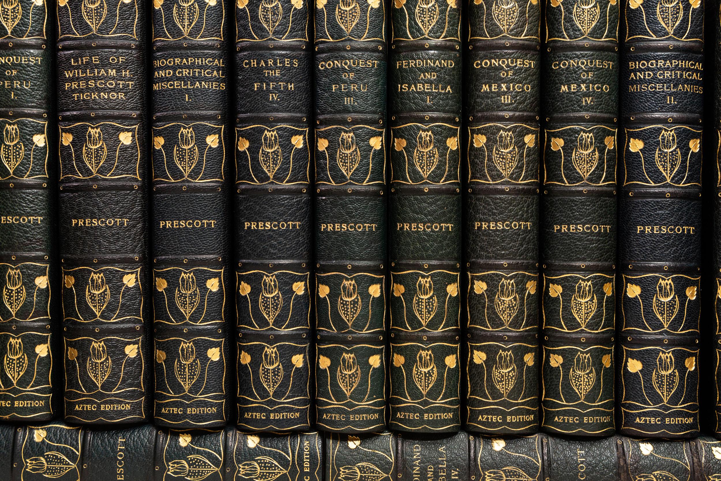 22 Volumes. William H. Prescott, The Works of William H. Prescott. Titles include, Philip the Second, Ferdinand and Isabella, Charles the Fifth, and more. Bound in 3/4 blue morocco. Marbled boards. Raised bands. Decorative floral emblems in gilt on