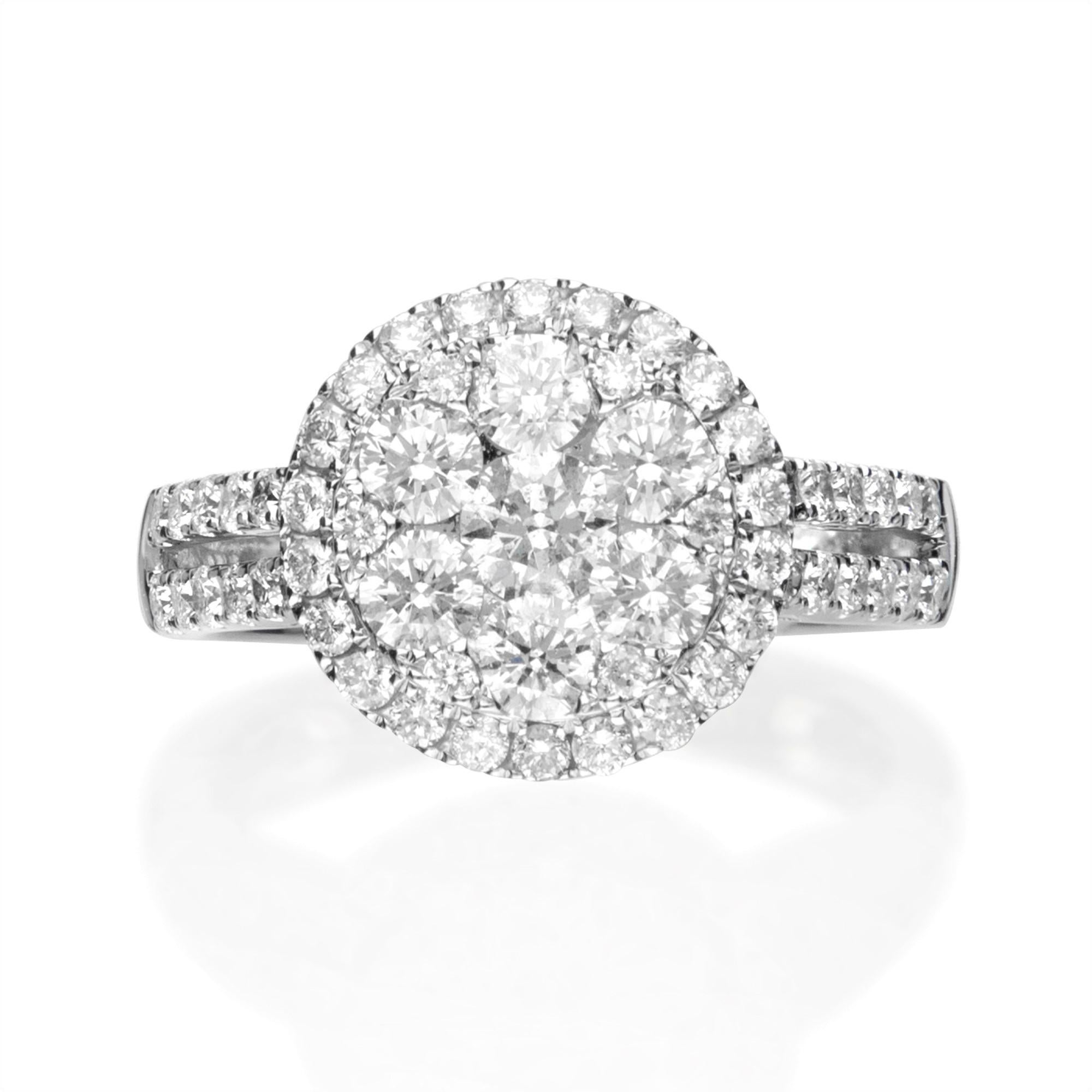 This unique Cluster ring has 1 Round Diamond that weighs 0.29 Carats in the center, 6 diamonds 1.12 ct. and 54 diamonds around it 0.79 ct., all with GH-SI quality. The Cluster setting gives a big Diamond ring look and it is a perfect engagement ring