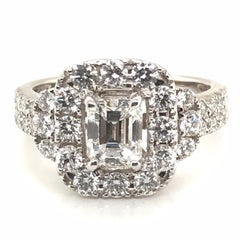 2.20 Carat Emerald Cut Center with Round Halo Diamond Ring