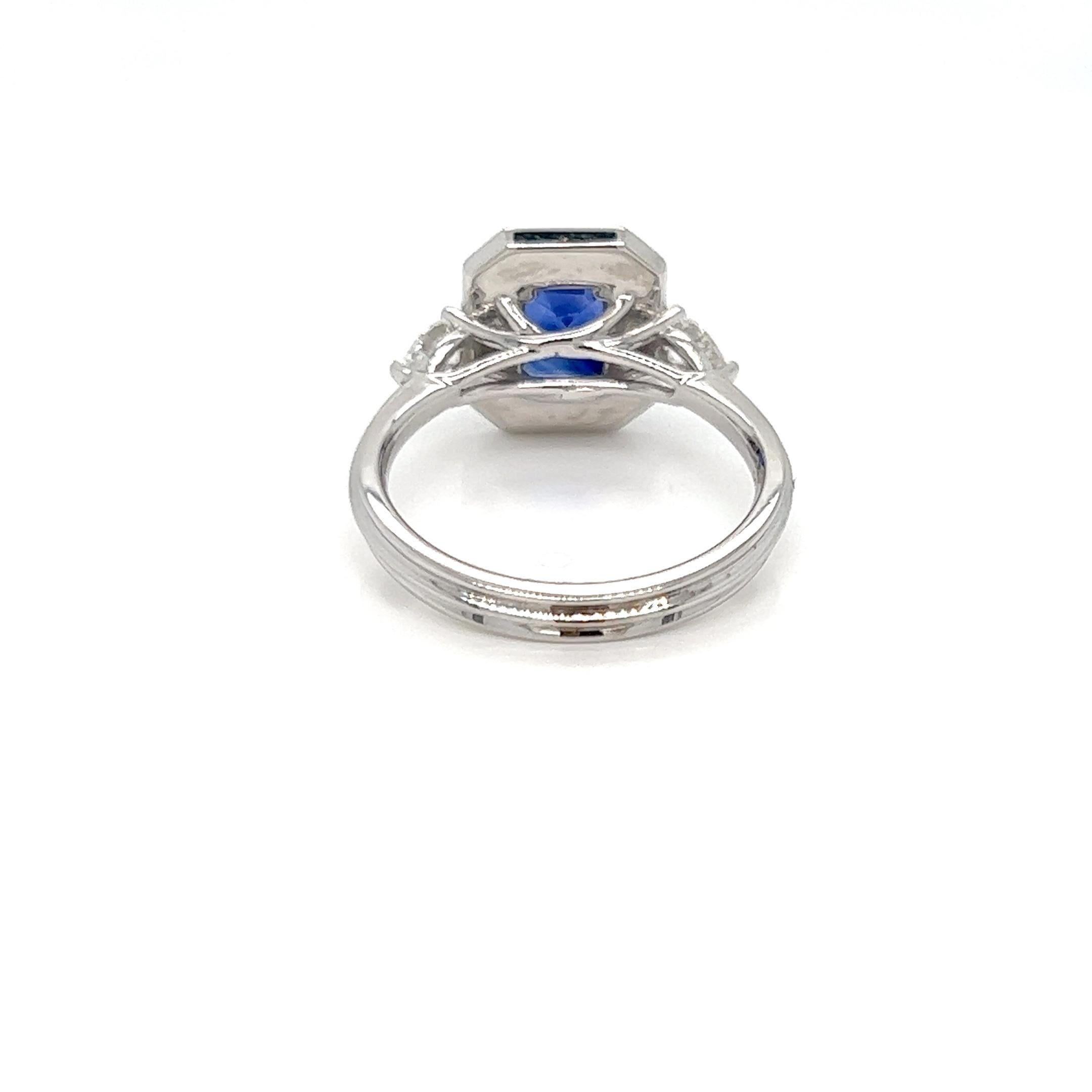 Modern 2.20 Carat Emerald cut Sapphire Diamond Halo Engagement Ring For Sale