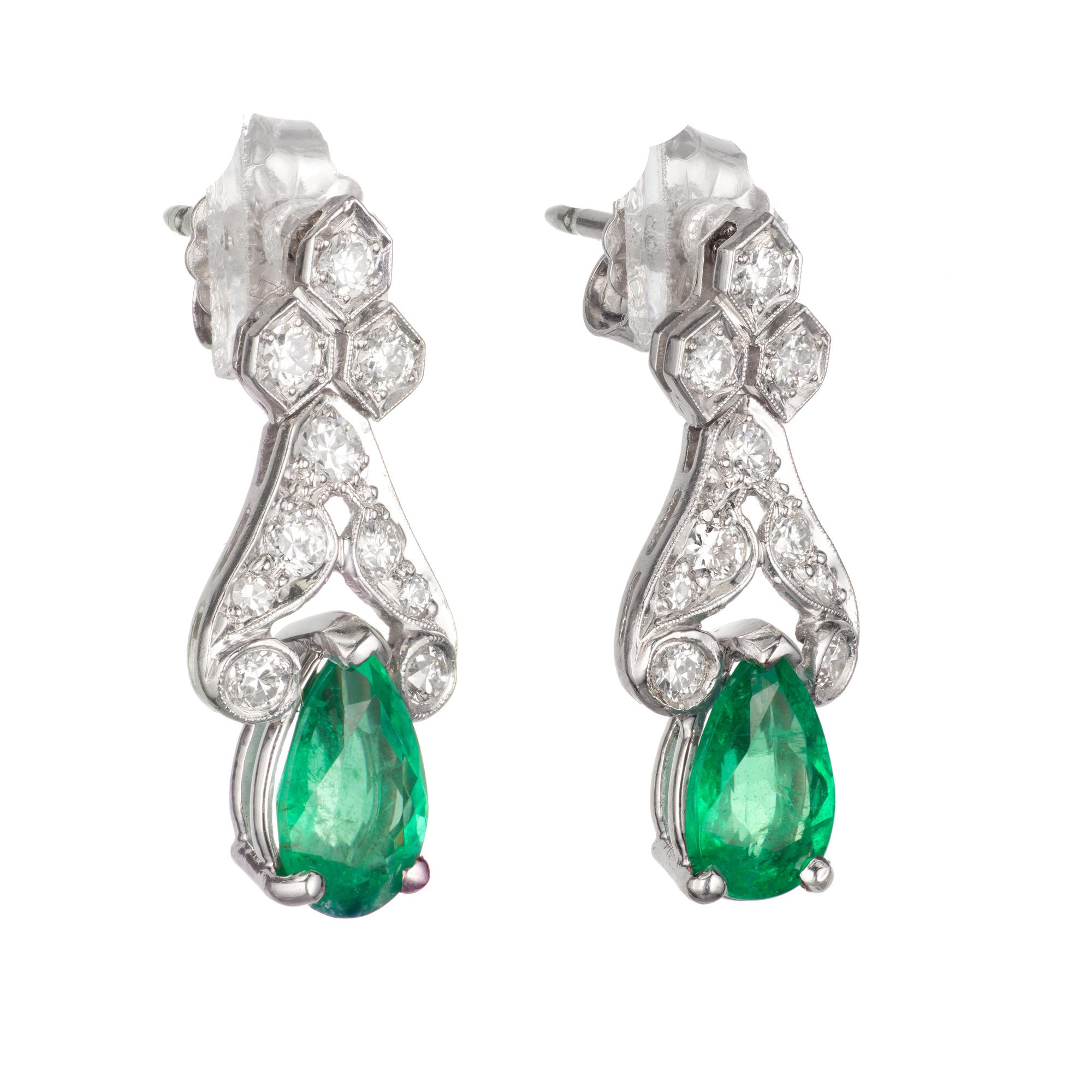 1940's pear shaped Emerald and Diamond Platinum Dangle Earrings. Pierced post style. Random tested GIA certified Emerald 0.81 carat natural color minor F1 clarity enhancement only.  

2 pear shaped green I Emeralds, Approximate 1.80 total carat