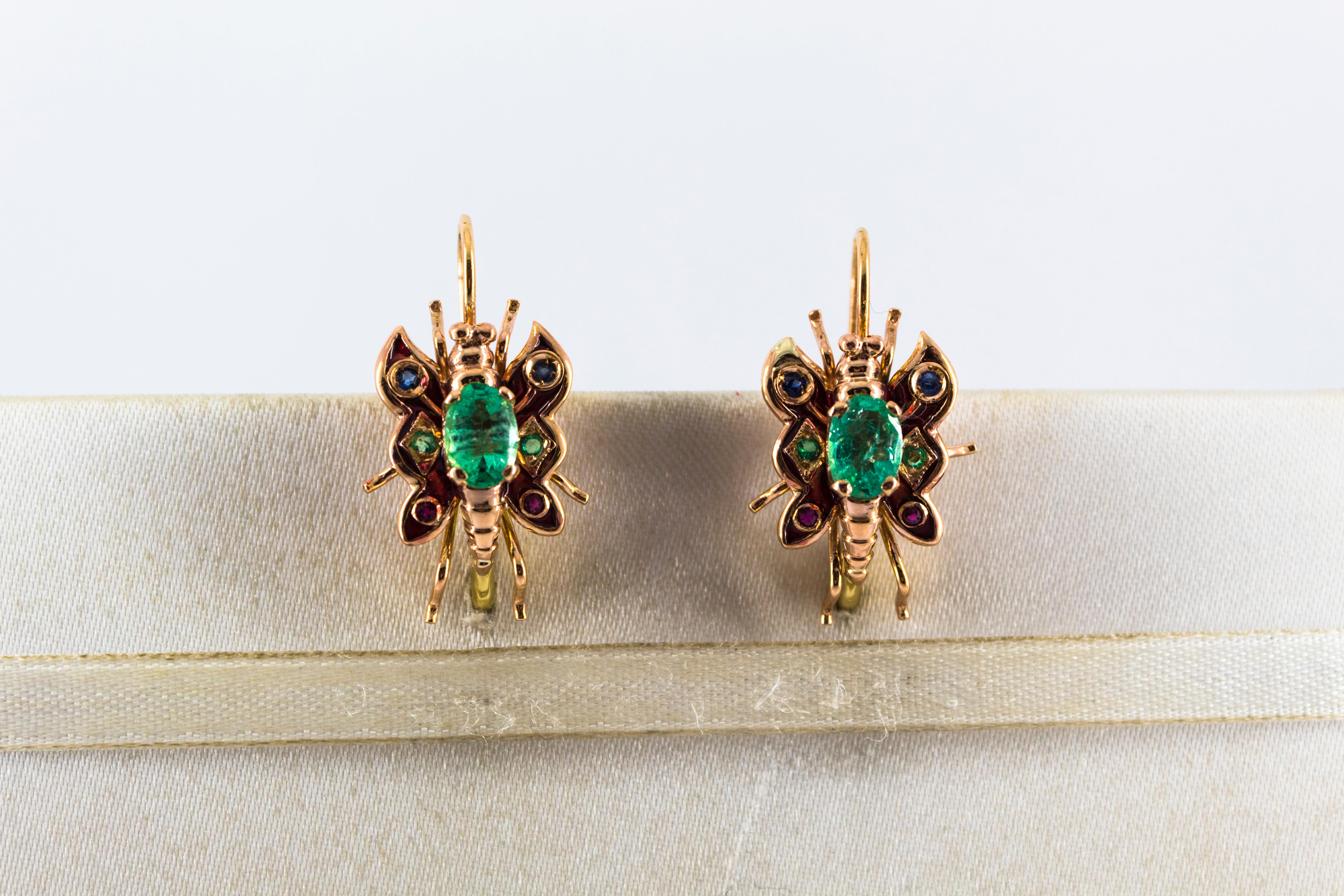 These Lever-Back Earrings are made of 9K Yellow Gold.
These Earrings have also 2.20 Carats of Emeralds, Rubies and Blue Sapphires.
These Earrings are available with central Ruby, Emerald or Blue Sapphire.
These Earrings have also Enamel.
All our