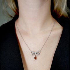 2.20 Carat Fancy Orangy Brown Diamond Pendant Bow Necklace In Platinum GIA Cert.