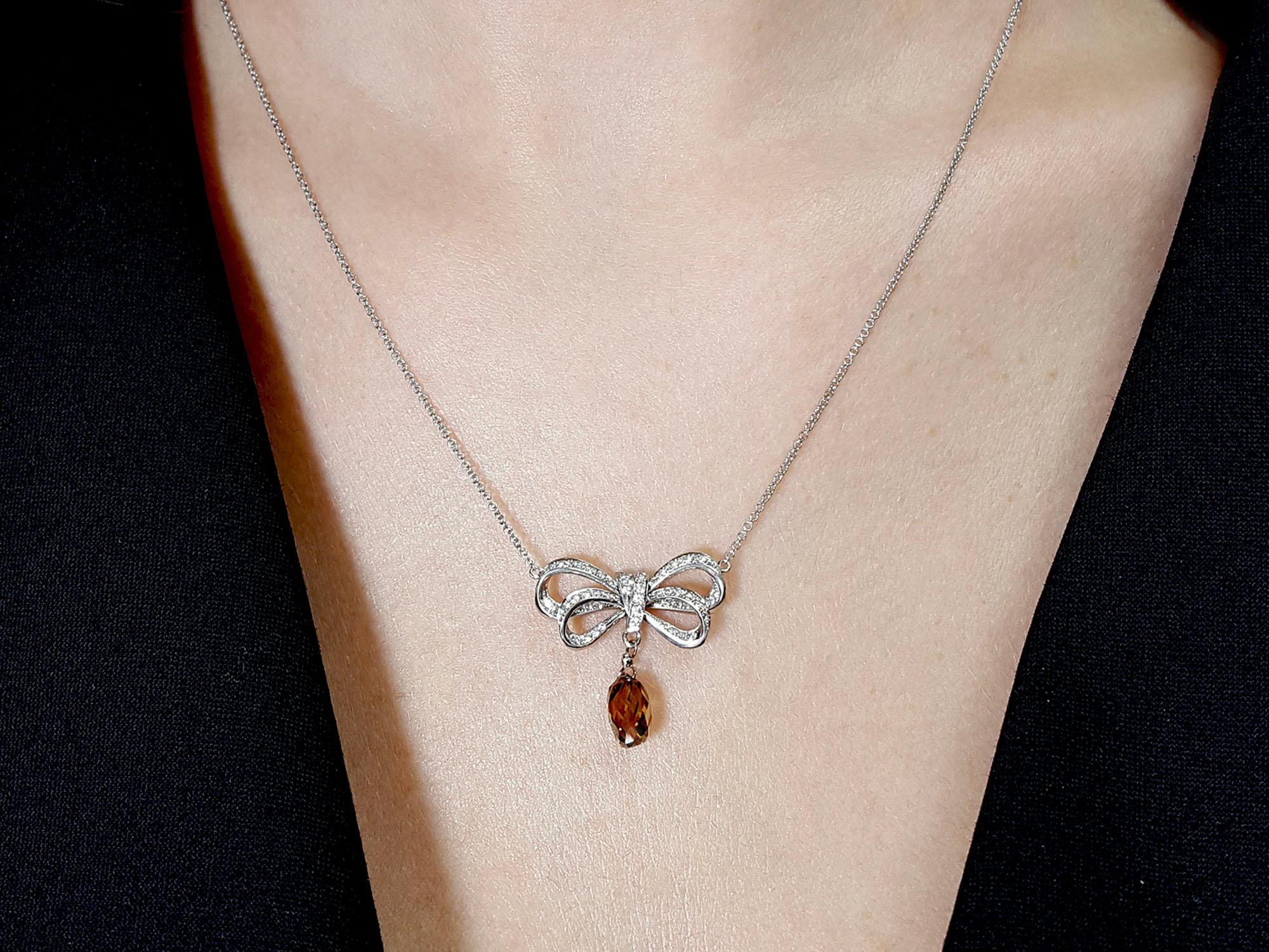 Contemporary 2.20 Carat Fancy Orangy Brown Diamond Pendant Bow Necklace In Platinum GIA Cert. For Sale