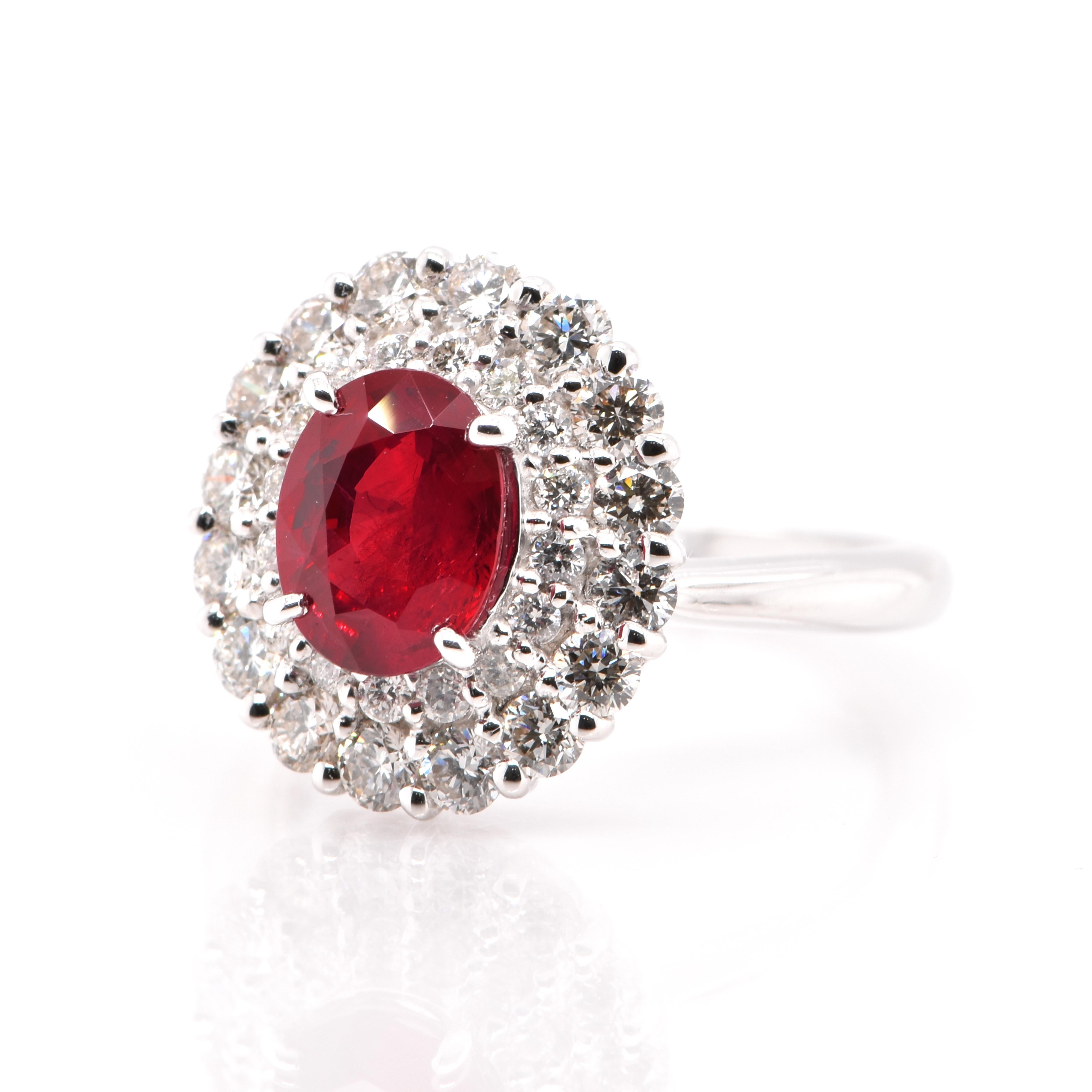 A stunning Ring featuring a GIA Certified, 2.20 Carat, Natural, Pigeon's Blood, Burmese Ruby and 1.24 Carats of Diamonds set in Platinum. Rubies are referred to as 