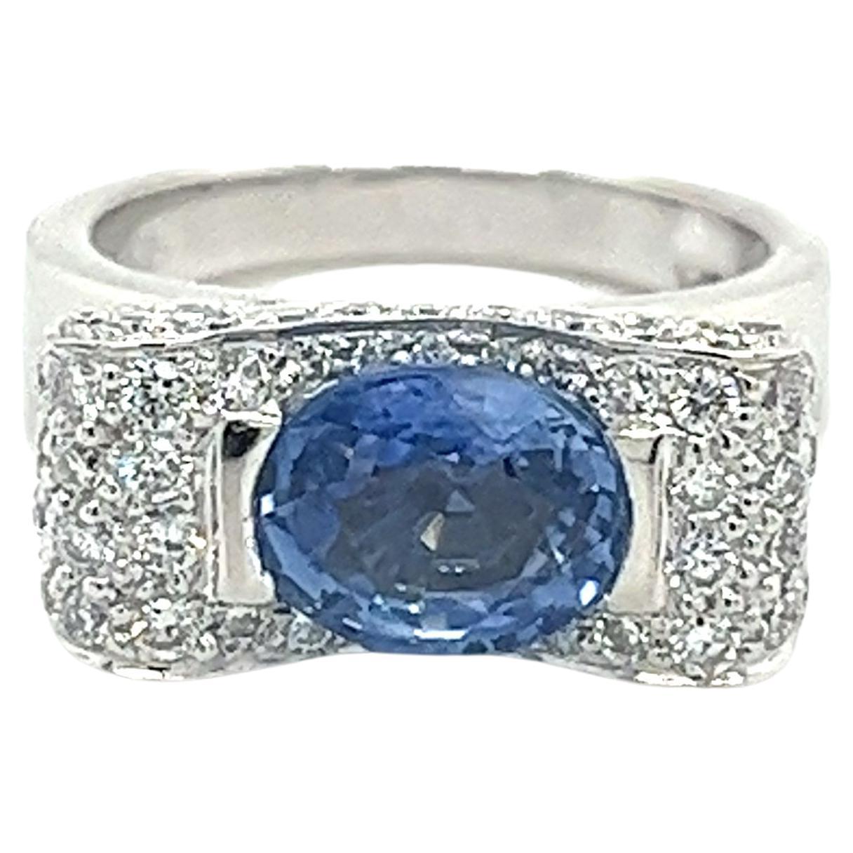 2.20 Carat Oval Cut Tanzanite Half Bezel Bow Ring in 18K White Gold Ring  For Sale