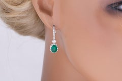 2.20 Carat Oval Emerald Lever-Back Hoop Earrings in 1.1 ct Diamond Halo ref610