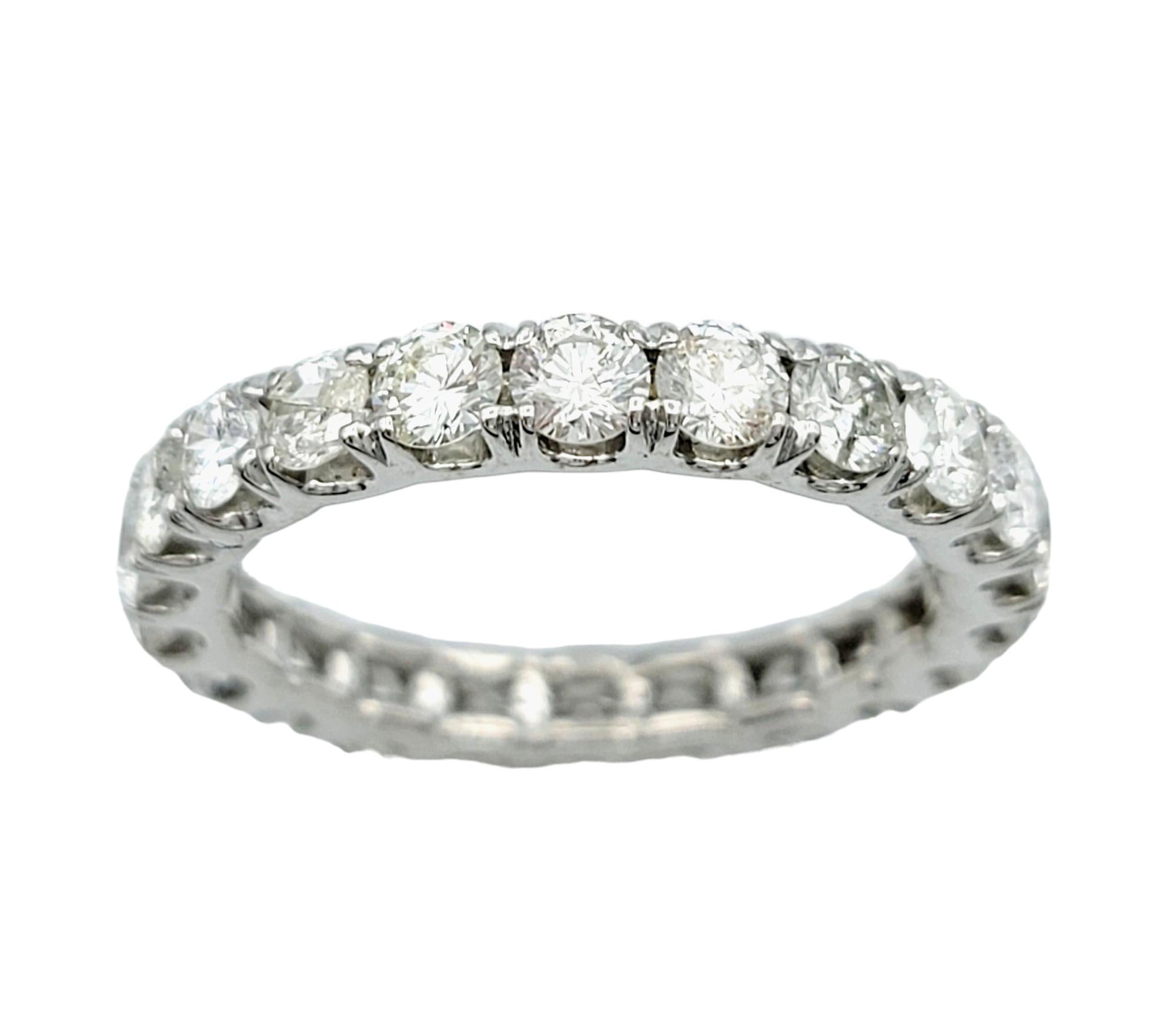 Ring Size: 6.75

This absolutely gorgeous band ring, set in exquisite 18 karat white gold, features a classic and versatile design. The coveted eternity style showcases a continuous row of shimmering round diamonds, creating a timeless and elegant