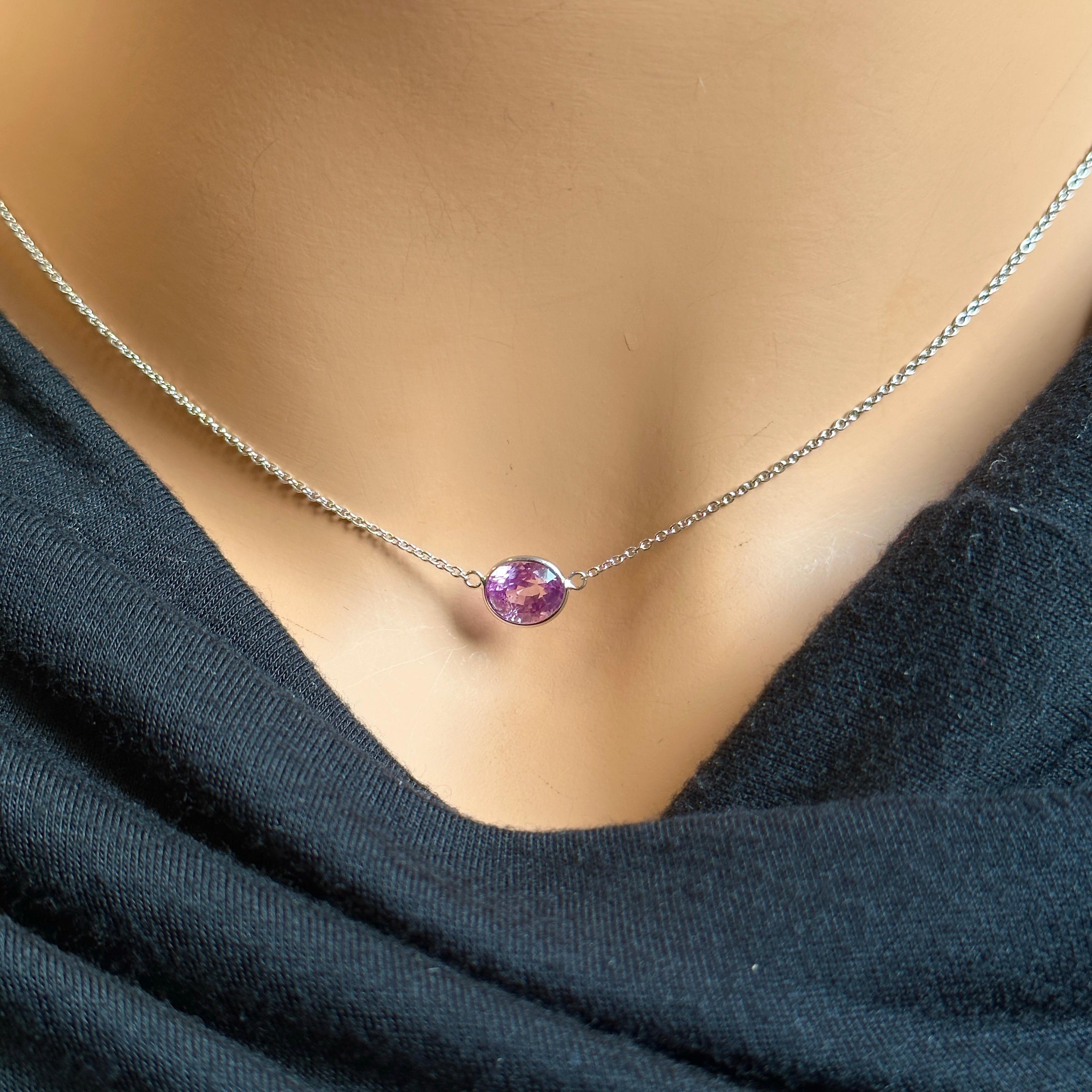 A fashion necklace crafted in 14k white gold with a main stone of a certified oval-cut purple sapphire weighing 2.20 carats would be a stunning and luxurious choice. Purple sapphires are known for their regal and captivating color, and the oval cut