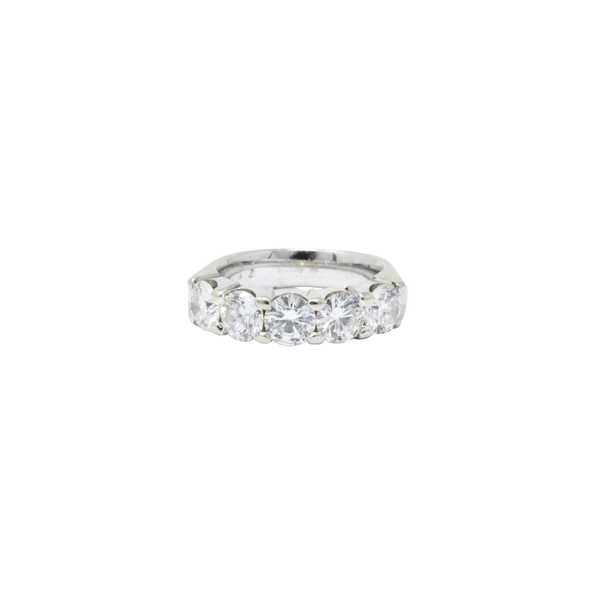Five stone diamond ring. The ring is set in thick 14K white gold. There are five shared prong round brilliant diamonds encompassing the front of the ring. 2.20 total carat weight, G-H color and VS clarity. The ring is 5 mm wide.
 

Ring Size: 4 1/2