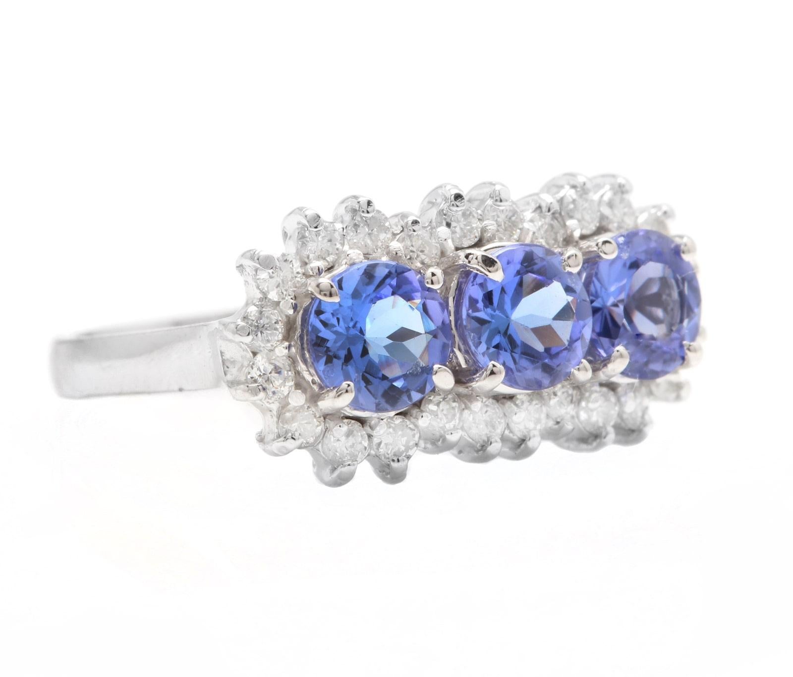 2.20 Carats Natural Very Nice Looking Tanzanite and Diamond 14K Solid White Gold Ring

Suggested Replacement Value:  $3,500.00

Total Natural Round Tanzanite Weight is: Approx. 1.70 Carats 

Tanzanite Measures Approx. 5.00mm

 Natural Round Diamonds