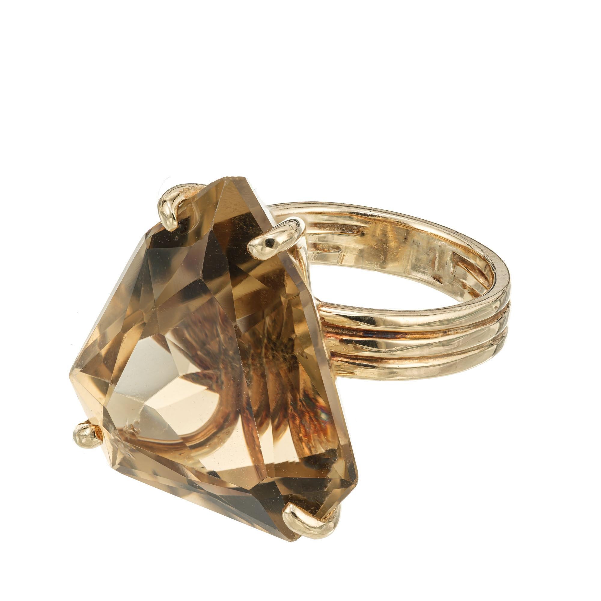 1950's shield shape Citrine Quartz ring. 22.00 center stone in a 14k yellow gold cocktail setting. 

1 Genuine shield shape Citrine 22.9 x 21.5 x 11mm, approx. total weight 22.00cts
Size 7 and sizable
14k Yellow Gold
Tested: 14k
10.8 grams
Width at