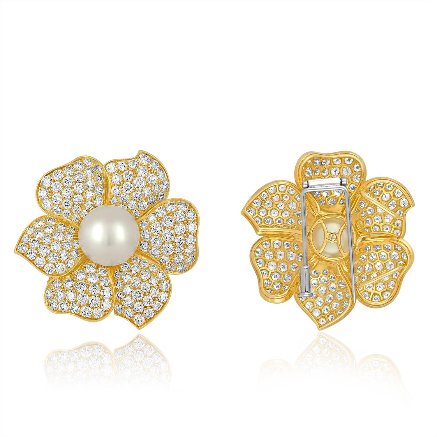 Stunning Flower Set
The set is 18K Yellow & White Gold
The earrings are 11.50 Carat In Diamonds E/F VVS
The earrings weigh 29.8 Grams
The earrings pearls are 12.2MM South Sea
The earrings are 1.25