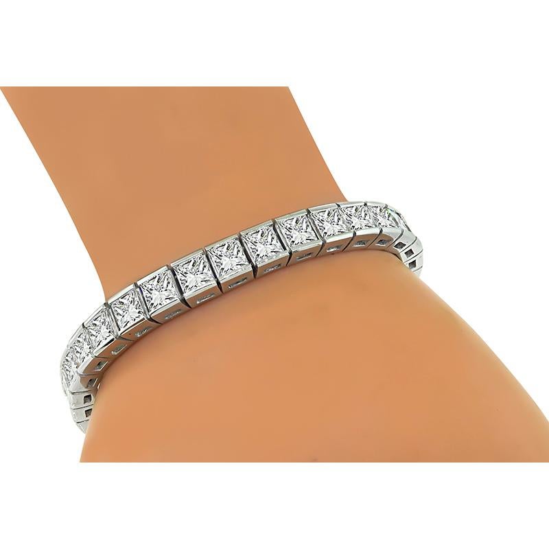 This is a stunning platinum bracelet. The bracelet is set with sparkling princess cut diamonds that weigh approximately 22.00ct. The color of these diamonds is F-G with VVS1-VVS2 clarity. The bracelet measures 7 inches in length and 7mm in width.