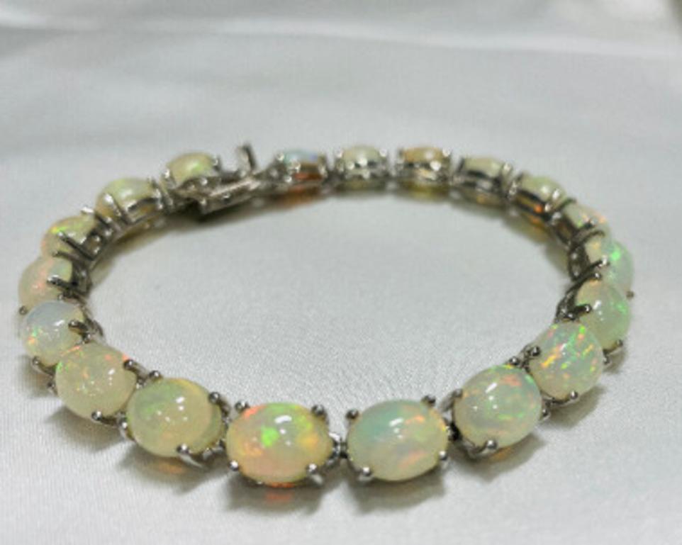 Oval Cut 22.04 Carat Genuine Ethiopian Fire Opal Tennis Bracelet for Mom Sterling Silver For Sale