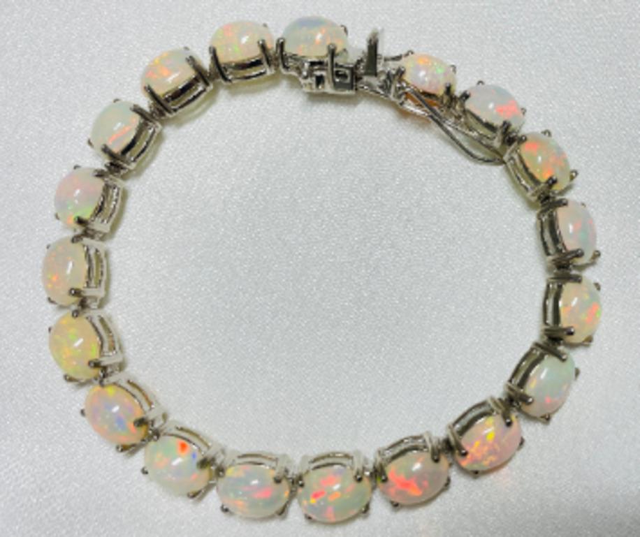 Oval Cut 22.04 Carat Genuine Ethiopian Fire Opal Tennis Bracelet in Sterling Silver For Sale