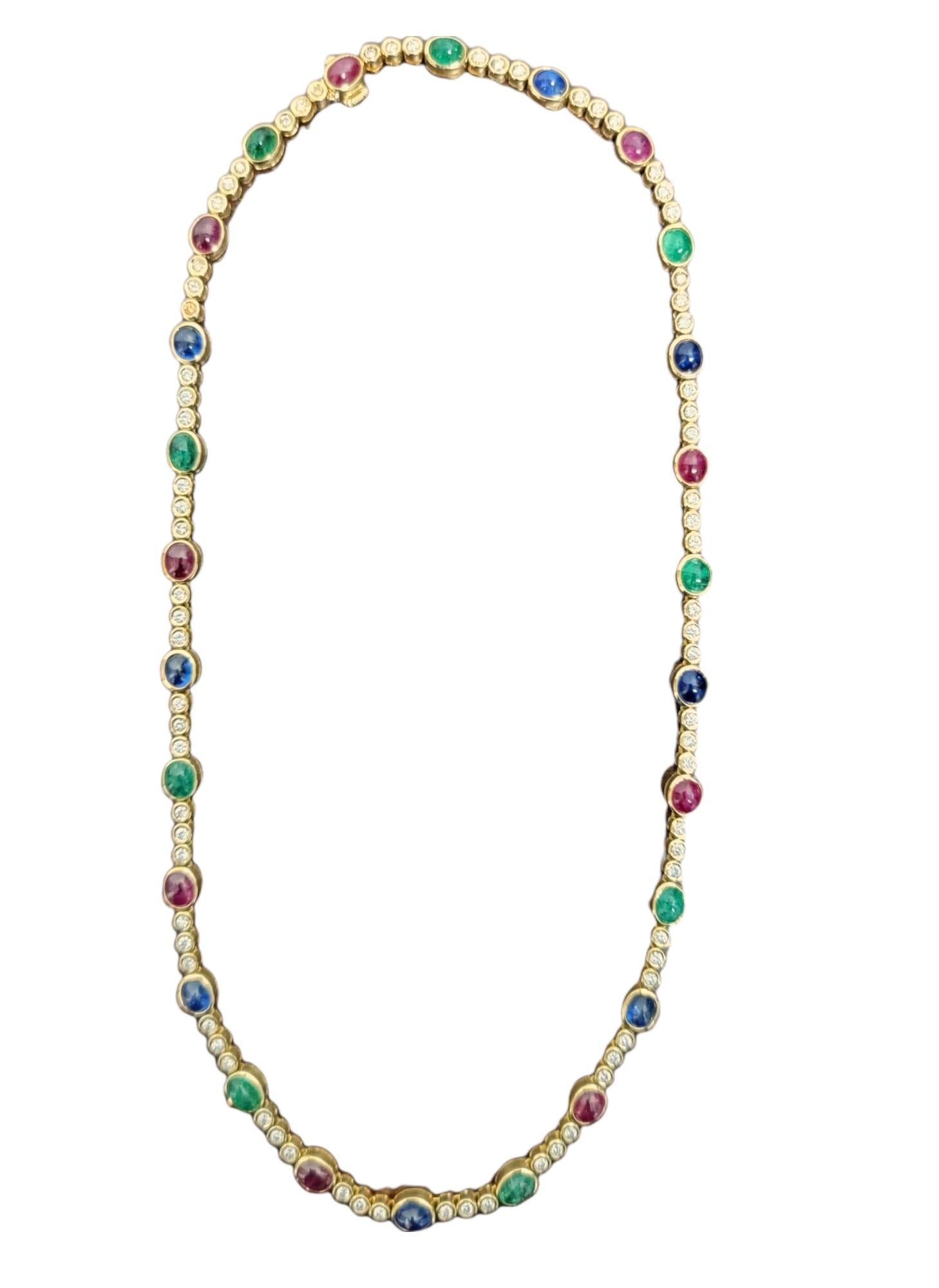 Colorful and elegant multi-gemstone choker style necklace. The rich, vibrant colors and bright, sparkling diamonds truly make this necklace shine on the neck. Oval cabochon shaped rubies, emeralds and sapphires are bezel set in polished 18 karat
