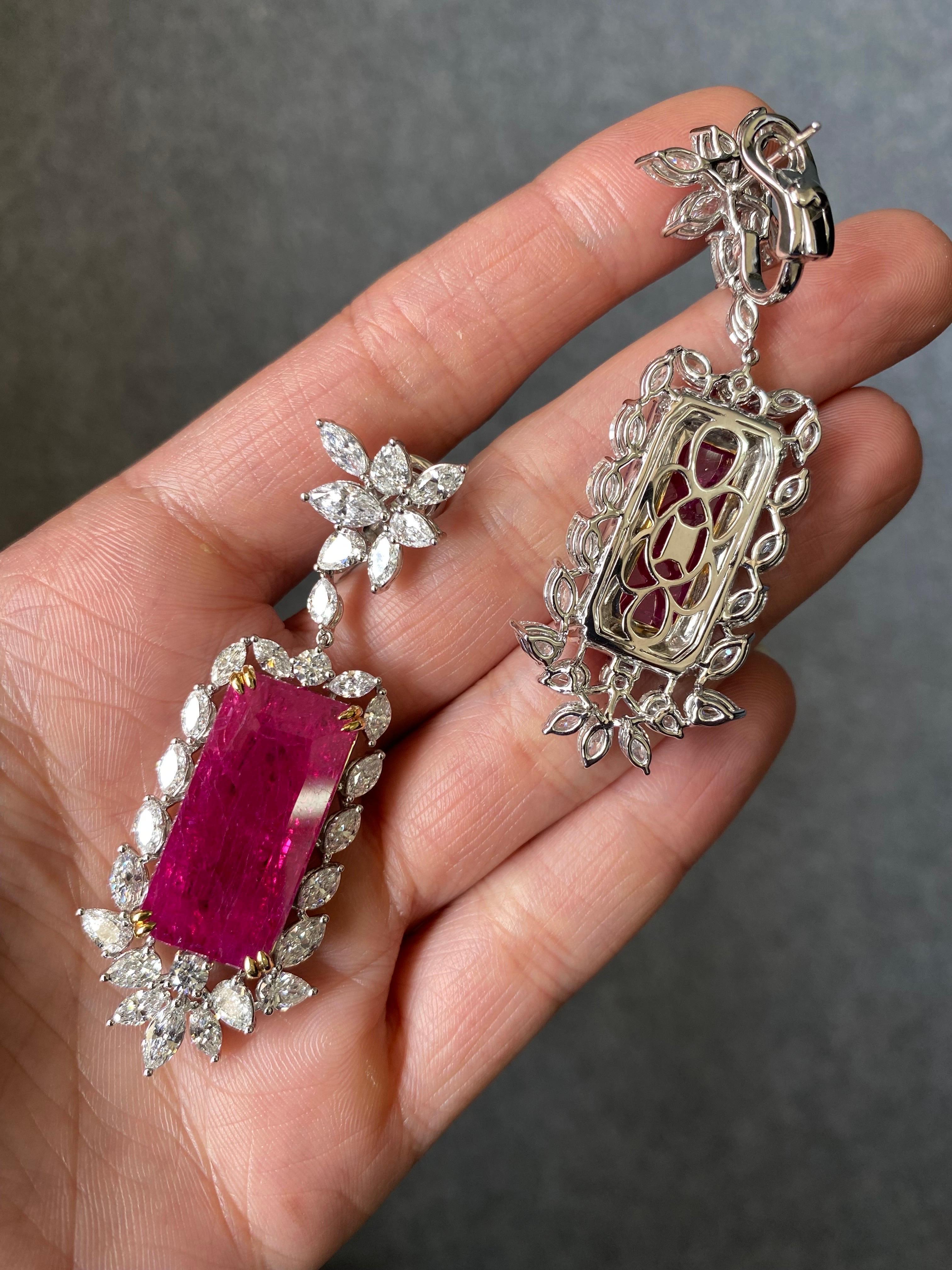One of a kind 22.07 carat no heat natural no heat Mozambique Ruby earrings, with 7.43 carat VS quality colorless Diamonds. 