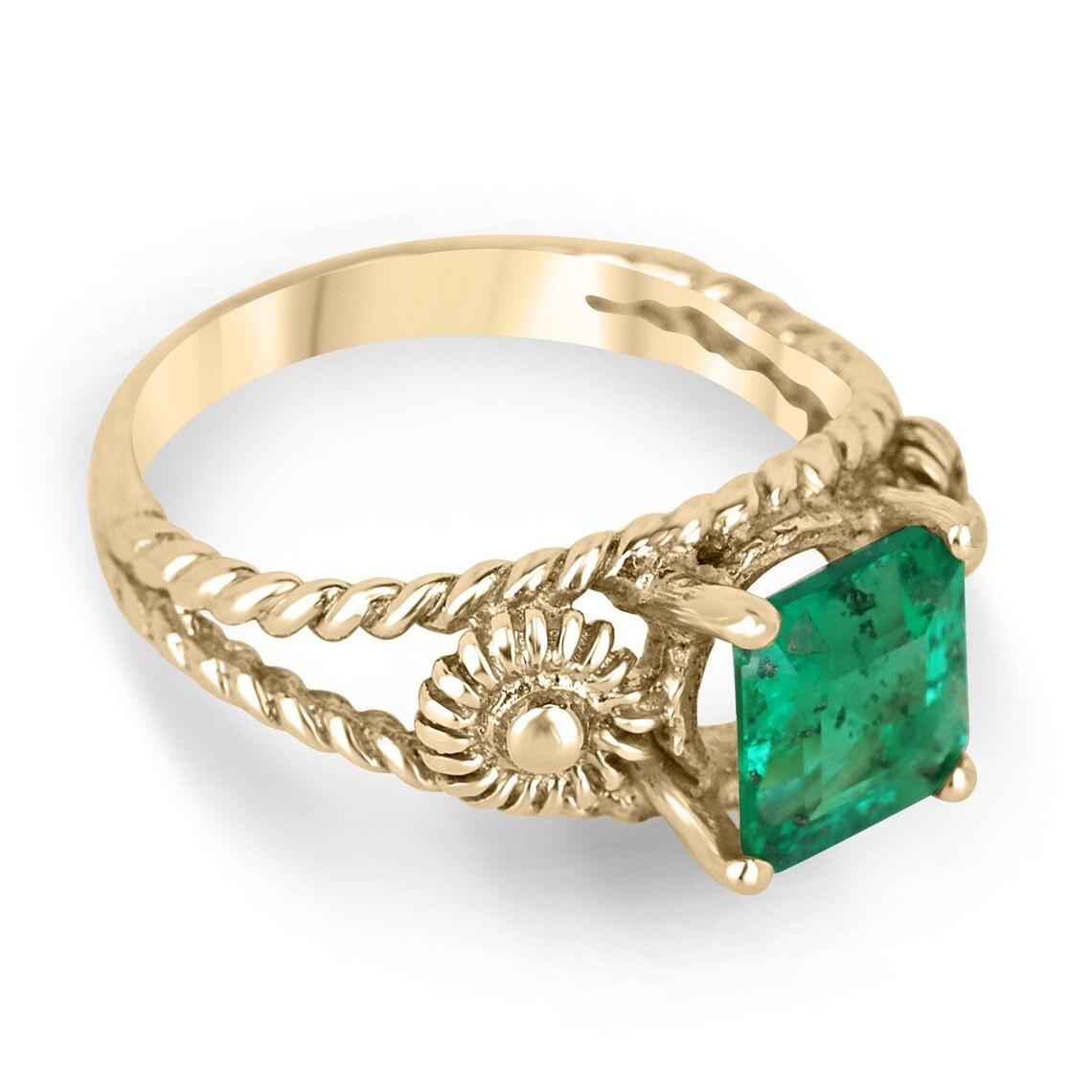 The solitaire emerald ring is a stunning piece of jewelry that is sure to catch the eye of anyone who sees it. The emerald is a rich, vivid green color and is set in a classic four-prong setting, which allows the stone to be the star of the show.