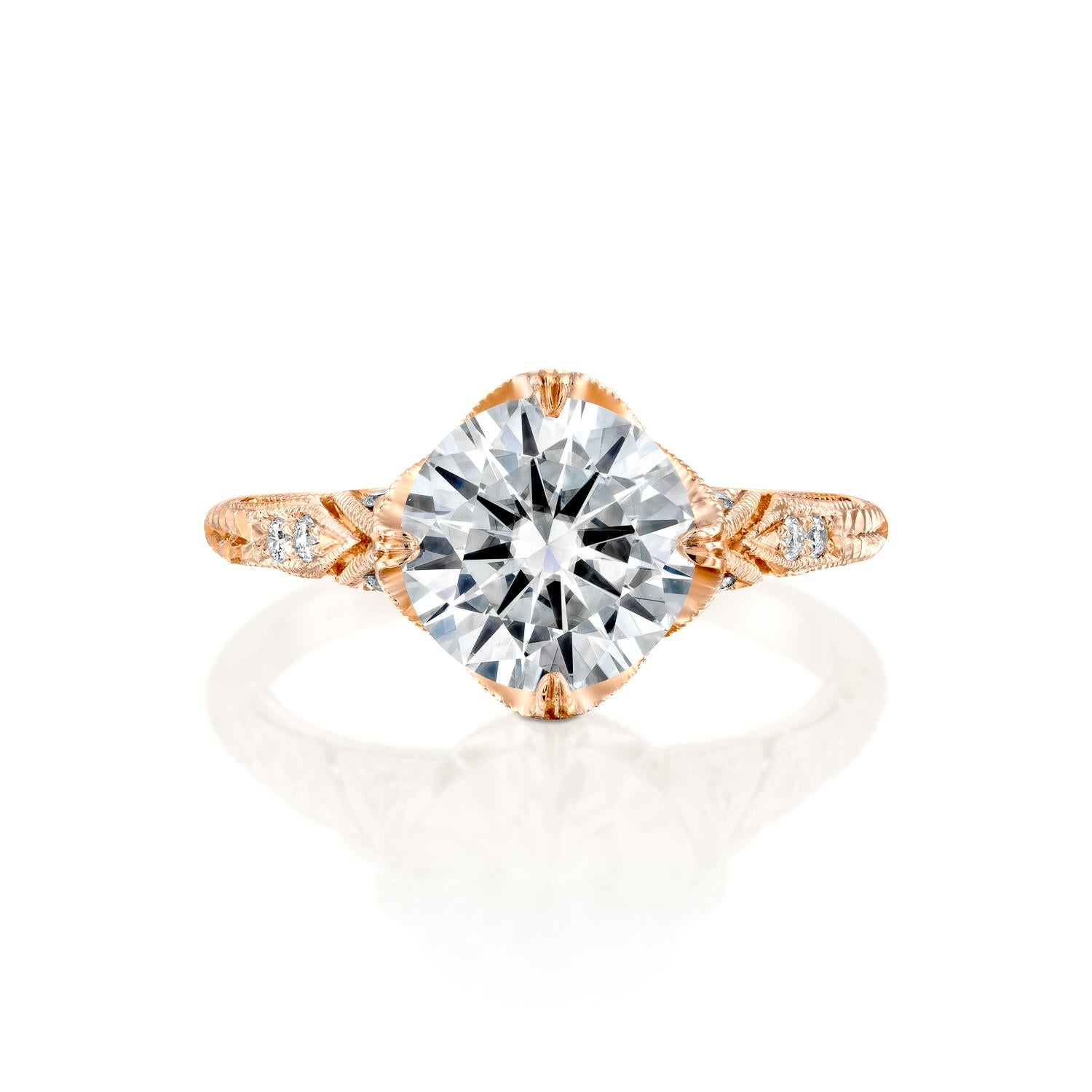 This gorgeous ring features a solitaire GIA certified diamond. Center stone is natural 2 carat, round shaped 100% eye clean natural diamond of F-G color and VS2-SI1 clarity and it is surrounded by smaller natural round diamonds of 0.2 total carat