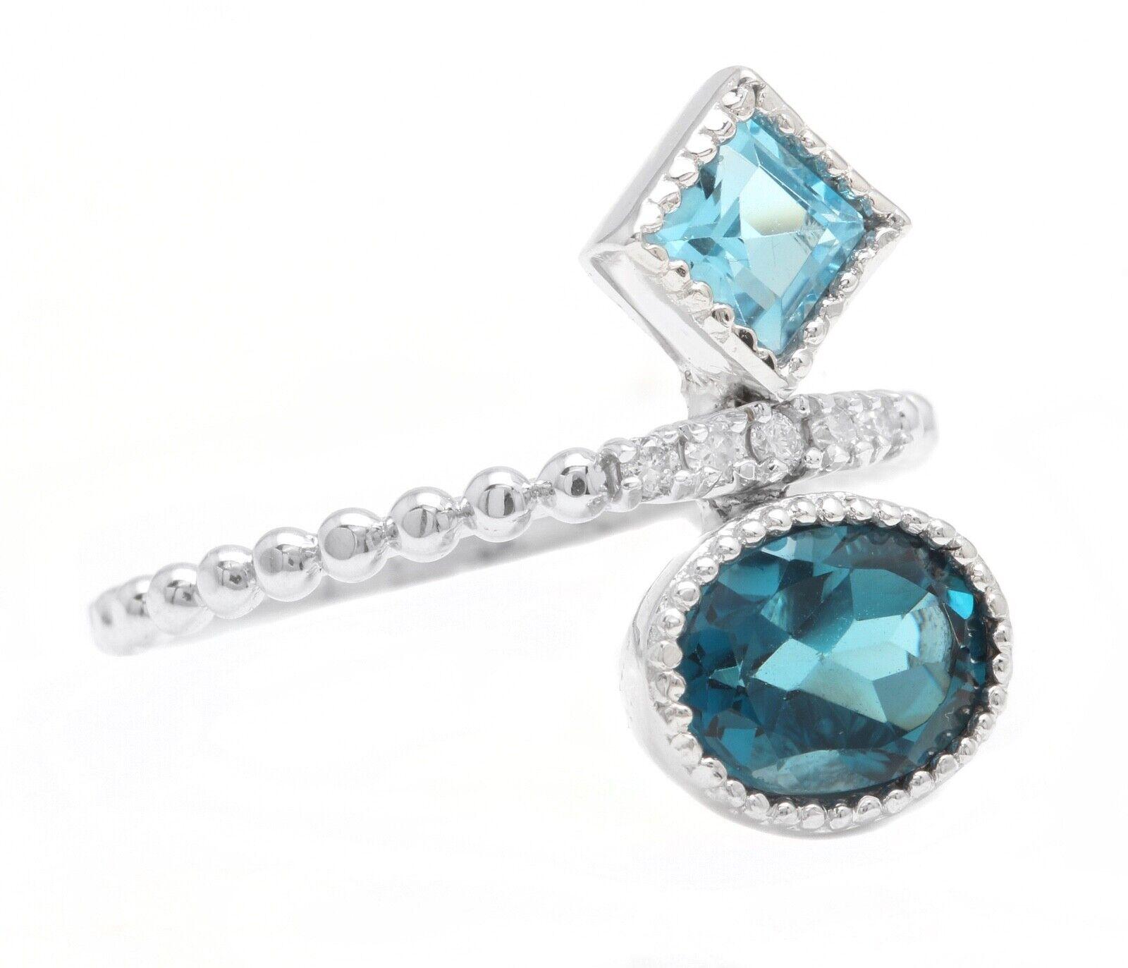 2.20 Carat Natural London & Swiss Blue Topaz and Diamond 14K Solid White Gold Ring

Total London & Swiss Blue Topaz Weight is: Approx. 2.10 Carats 
                                                                                                     
