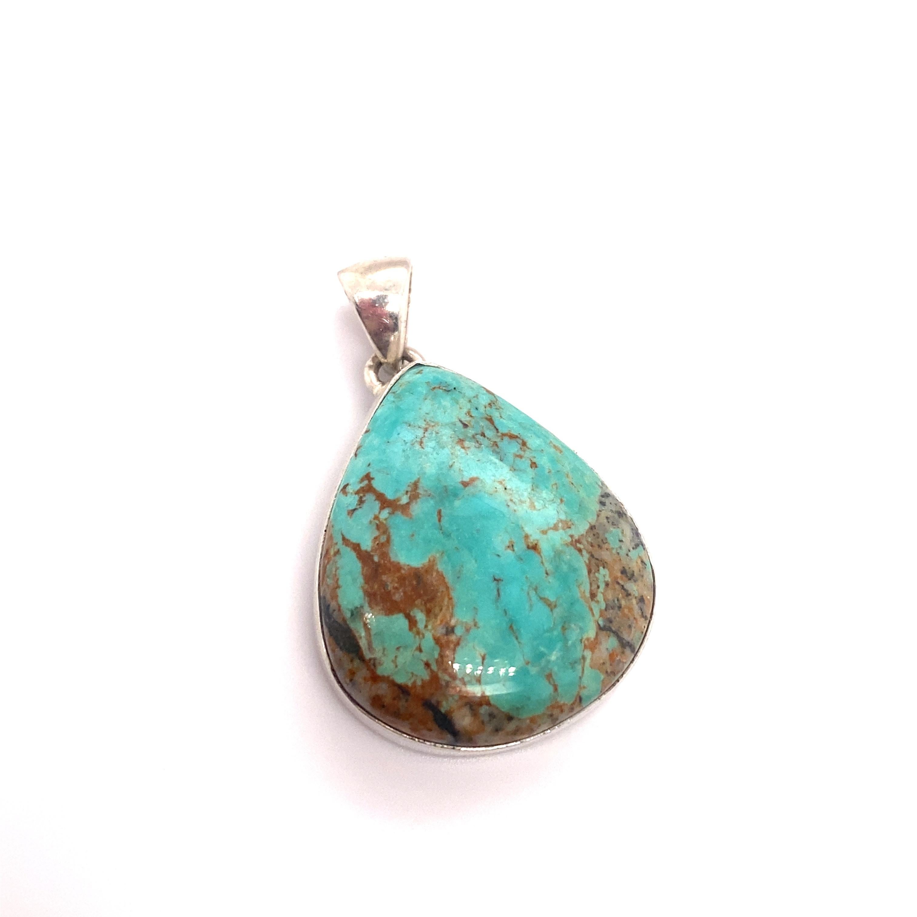 
Item Details: This pendant features a vibrant blue turquoise stone in a sterling silver setting.

Circa: 21st century
Metal Type: Sterling silver
Weight: 8.5g
Size: 1.5