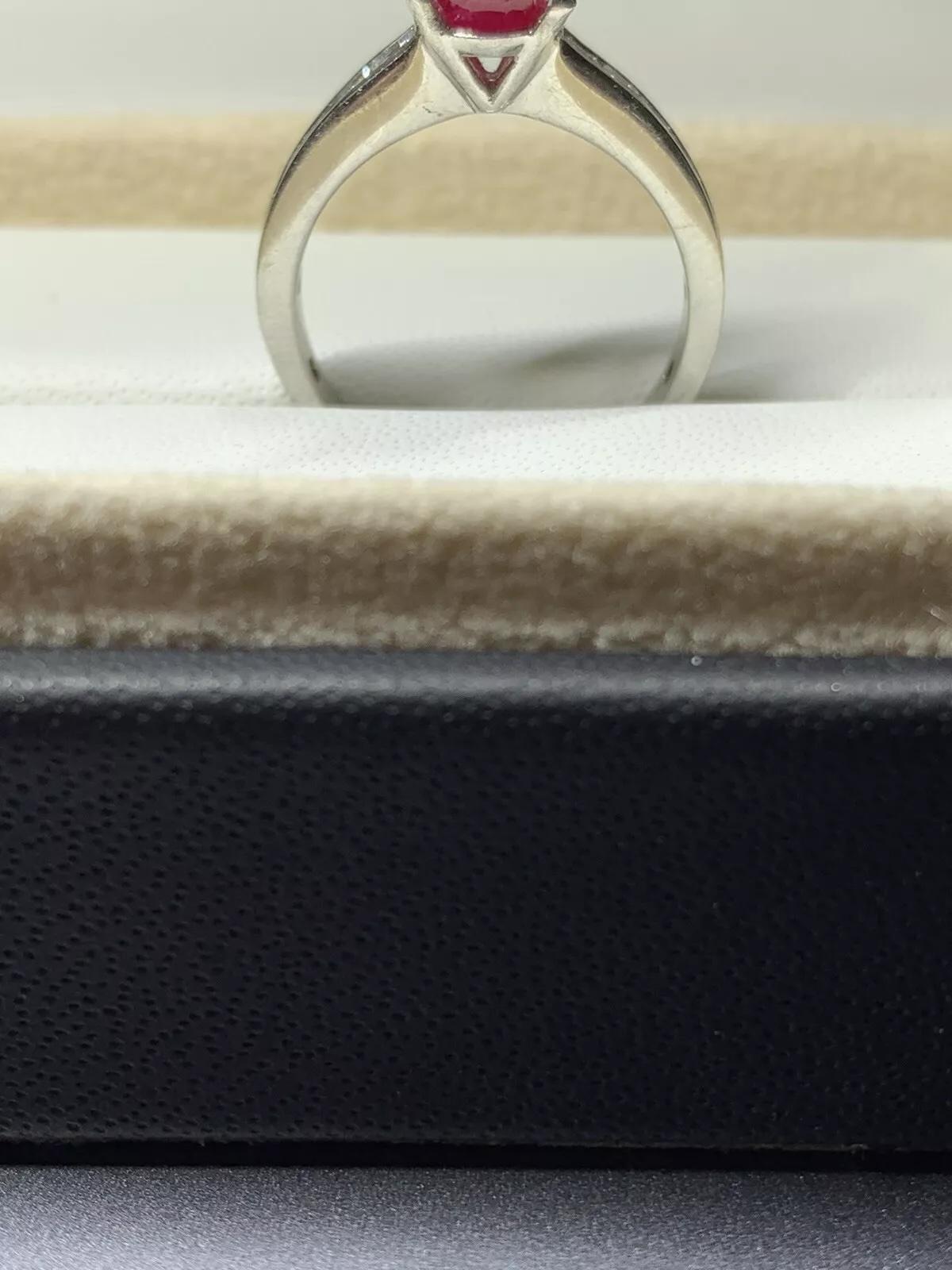 2.20ct Ruby and baguette diamond engagement ring in platinum.

Burma ruby ring with baguette diamonds in platinum.

Burma ruby cushion shape natural untreated total weight 1.40ct.

Baguette diamonds total weight 0.80ct F colour VS1 clarity.

The