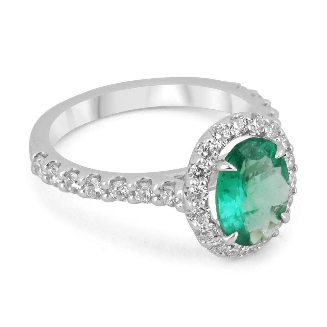 This is an exquisite, Zambian emerald and diamond halo ring. The gorgeous setting lets sit an excellent quality emerald with beautiful color and very good eye clarity. The emerald is not perfect and small imperfections do exist as it is a natural