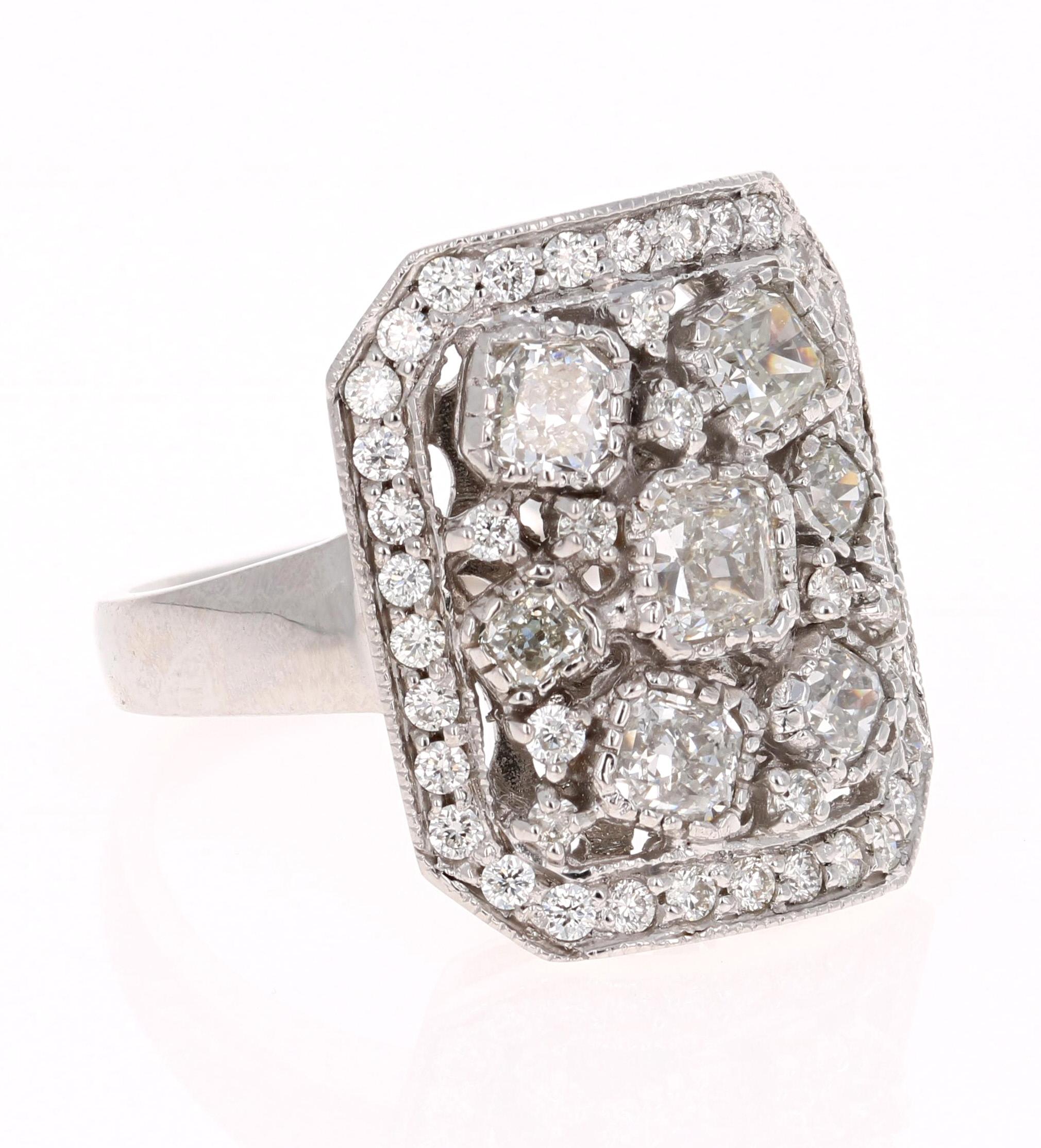 This unique and one of a kind cocktail ring has 7 Cushion Cut Diamonds that weigh 1.63 Carats and have a clarity and color of VS-G. The ring also has 43 Round Cut Diamonds that weigh 0.58 Carats. The total carat weight of the ring is 2.21 Carats.