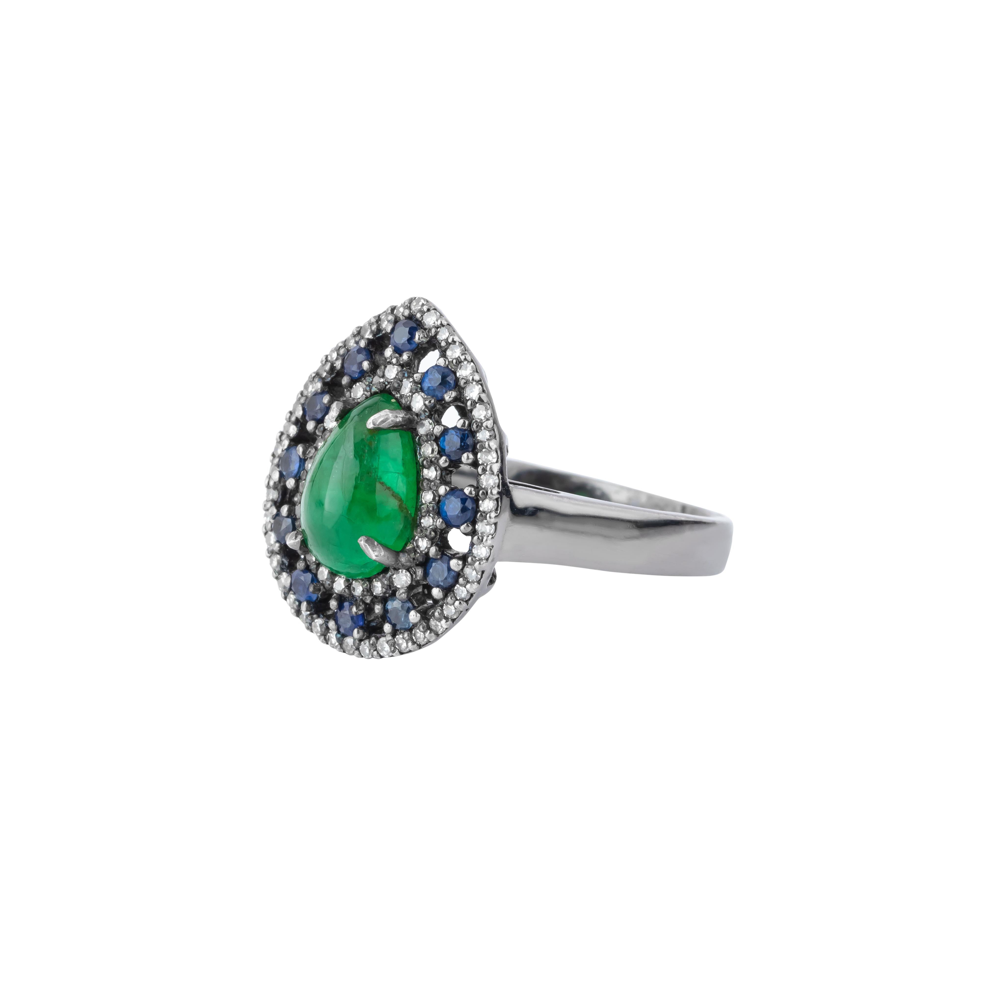 Epitomizing refined elegance, the 2.21 Carat Diamond, Emerald, and Sapphire Cocktail Ring showcases a stunning interplay of color and brilliance. At its center emerald exudes a vivid green hue, symbolizing renewal and luxury. Expertly cut to