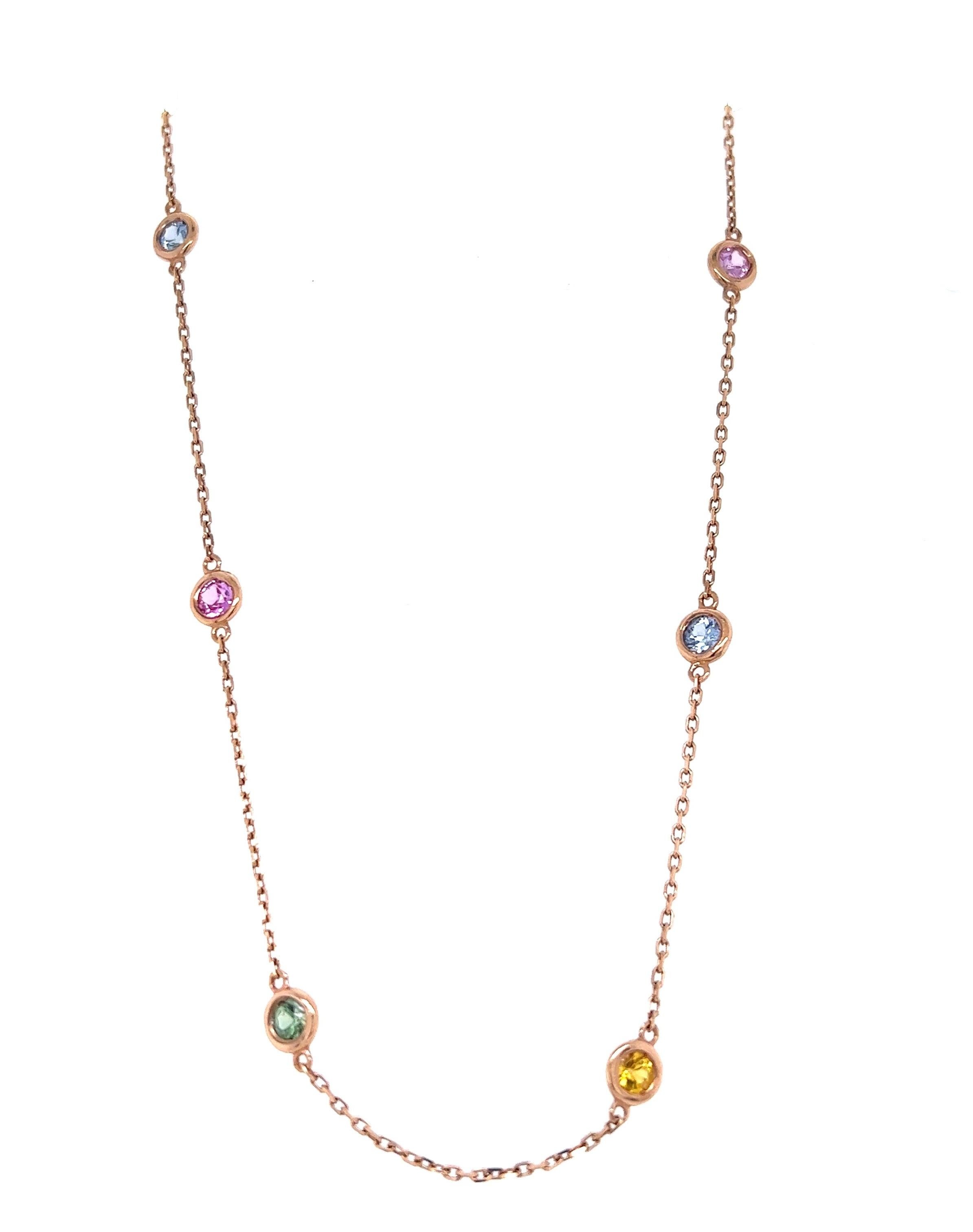 This necklace has 12 Multi Color Natural Sapphires that weigh 2.21 carats. They are Round Cut Sapphires and approximately measure at 3.5 mm in each bezel. 

Curated in 14 Karat Rose Gold and has an approximate weight of 4.8 grams

The length of the