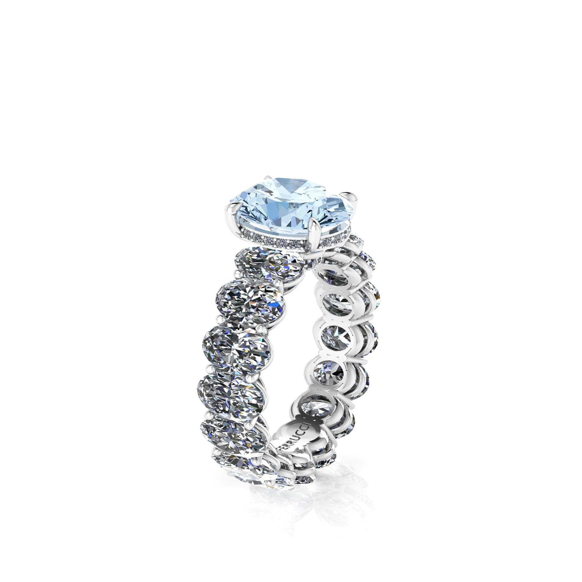 A  2.21 carat Oval blue Aquamarine, set on a Platinum 950 Oval diamond eternity ring, designed and hand made in New York with the gem
adorned by pave of white round diamonds, for a total diamond carat weight of 5.10 carats, color H, clarity SI1, 