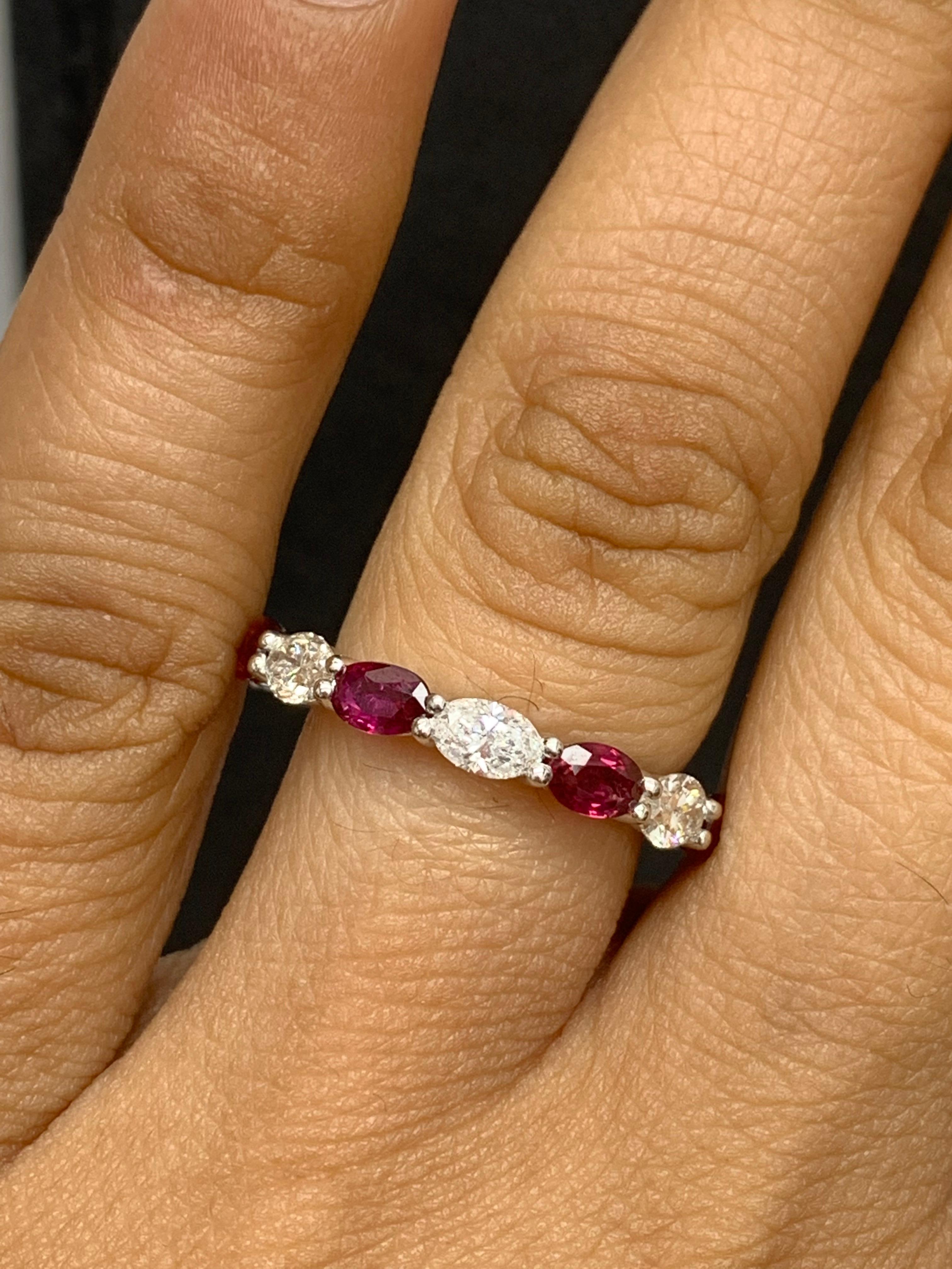 Handcrafted to perfection; showcasing color-rich oval cut rubies that elegantly alternate brilliant oval cut diamonds in a 14k white gold setting. 
The 7 Rubies weigh 2.21 carats total and 7 diamonds weigh 1.41 carats total.

Size 6.5 US (Sizable).