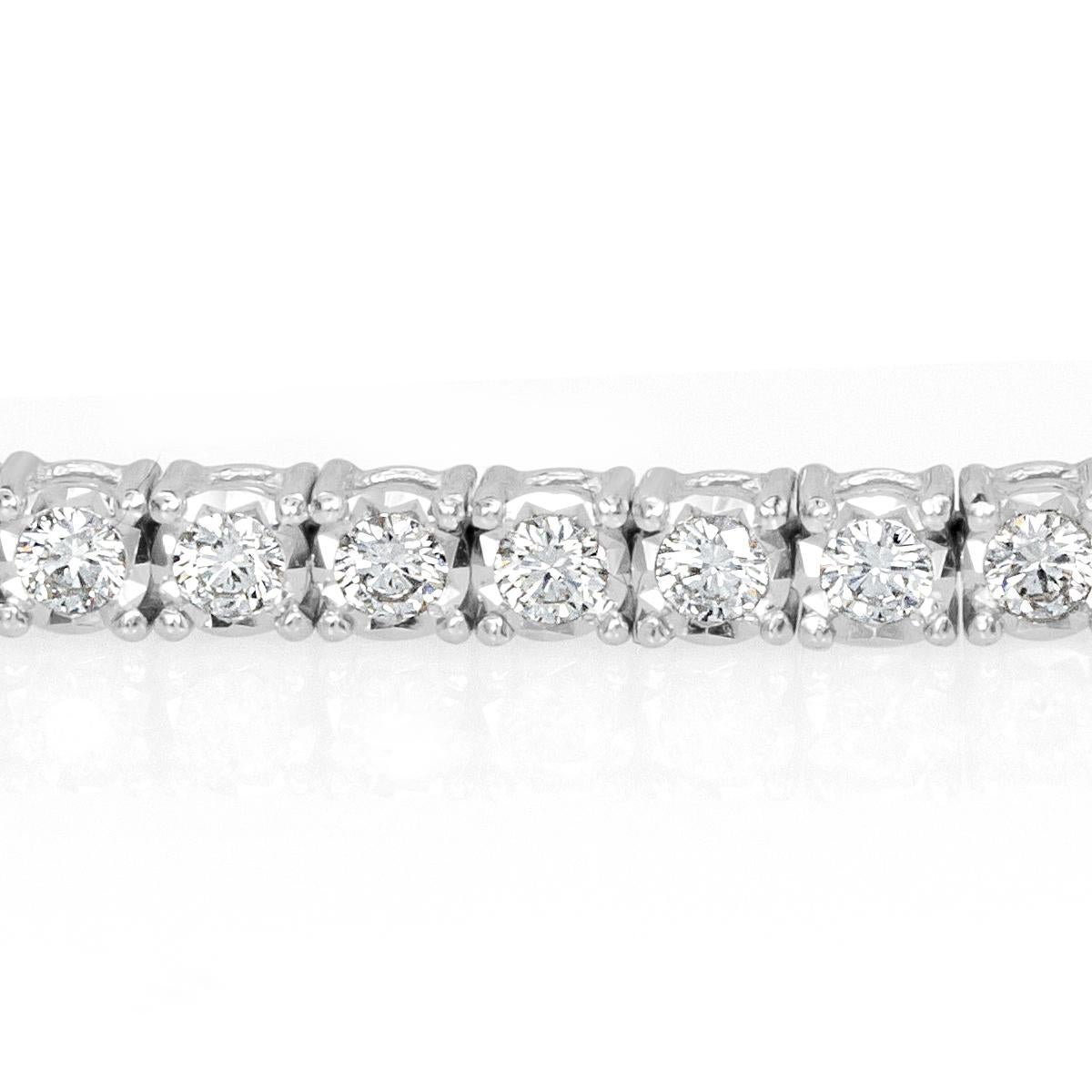 This exquisite diamond tennis bracelet showcases 2.21ct of perfectly matched round brilliant cut diamonds graded at F-G in color, VS1-VS2 in clarity. The diamonds are set in a classic, 14k white gold setting with double safety clasp for added