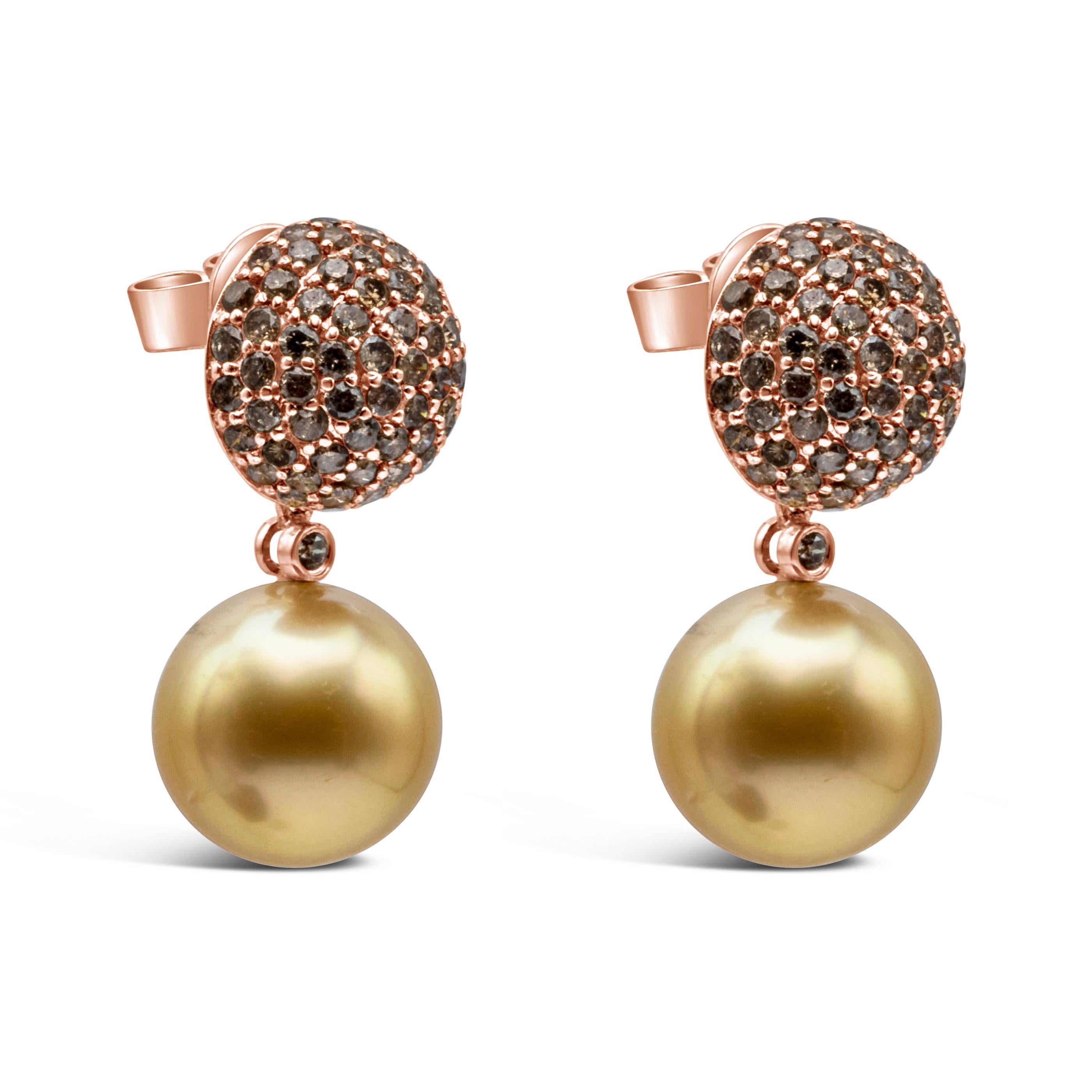 This classy and elegant stud earrings showcases 11-12 mm south sea golden pearls weighing 4.25 grams and the champagne diamond weighing 2.21 carats total, set in a micro-pave and suspended on a 18k rose gold diamond encrusted ball.

Style available