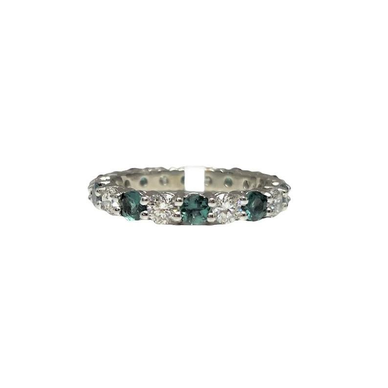 This stunning natural alexandrite & diamond eternity band features 10 diamonds weighing 1.01cts, graded F-G, SI, and 10 natural color-changing alexandrites weighing 1.2cts set in platinum.