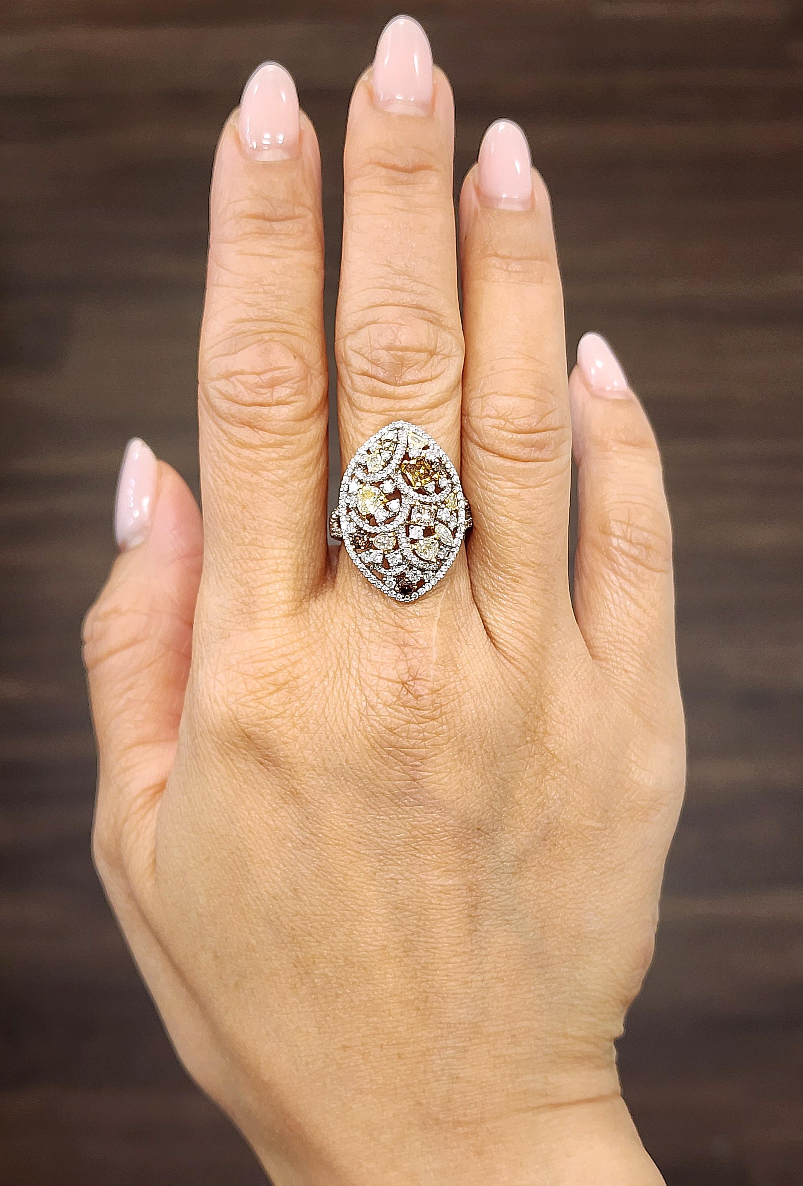 Treat yourself to this stunning 2.21 ct diamond ring, crafted from 18k white gold and boasting an array of natural brown, yellow, pink and white diamonds. The ring is size 6.5 and can be resized, and features a mix of VS2/SI1 clarity grade diamonds