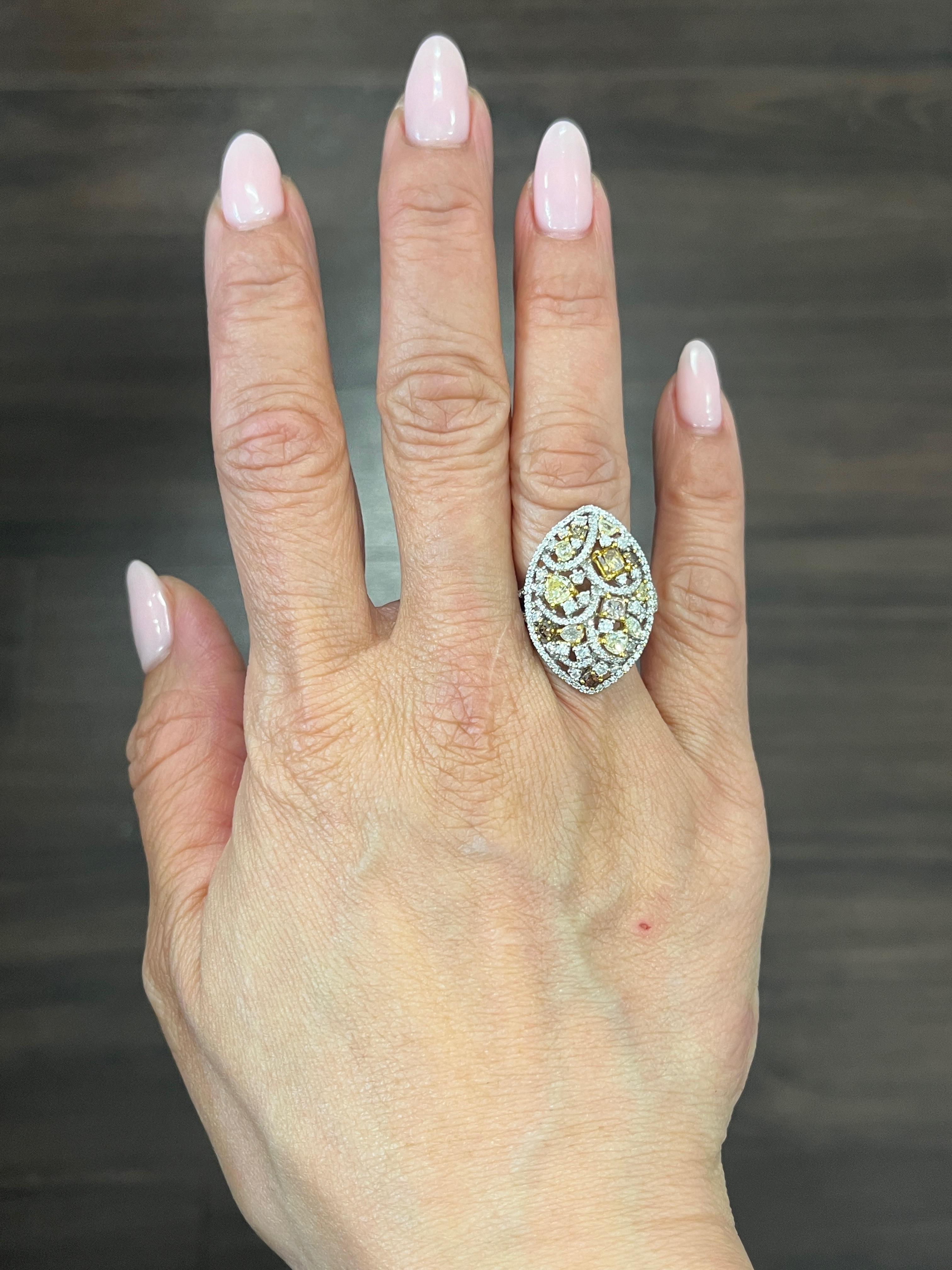 Treat yourself to this stunning 2.21 ct diamond ring, crafted from 18k white gold and boasting an array of natural brown, yellow, pink and white diamonds. The ring is size 6.5 and can be resized, and features a mix of VS2/SI1 clarity grade diamonds